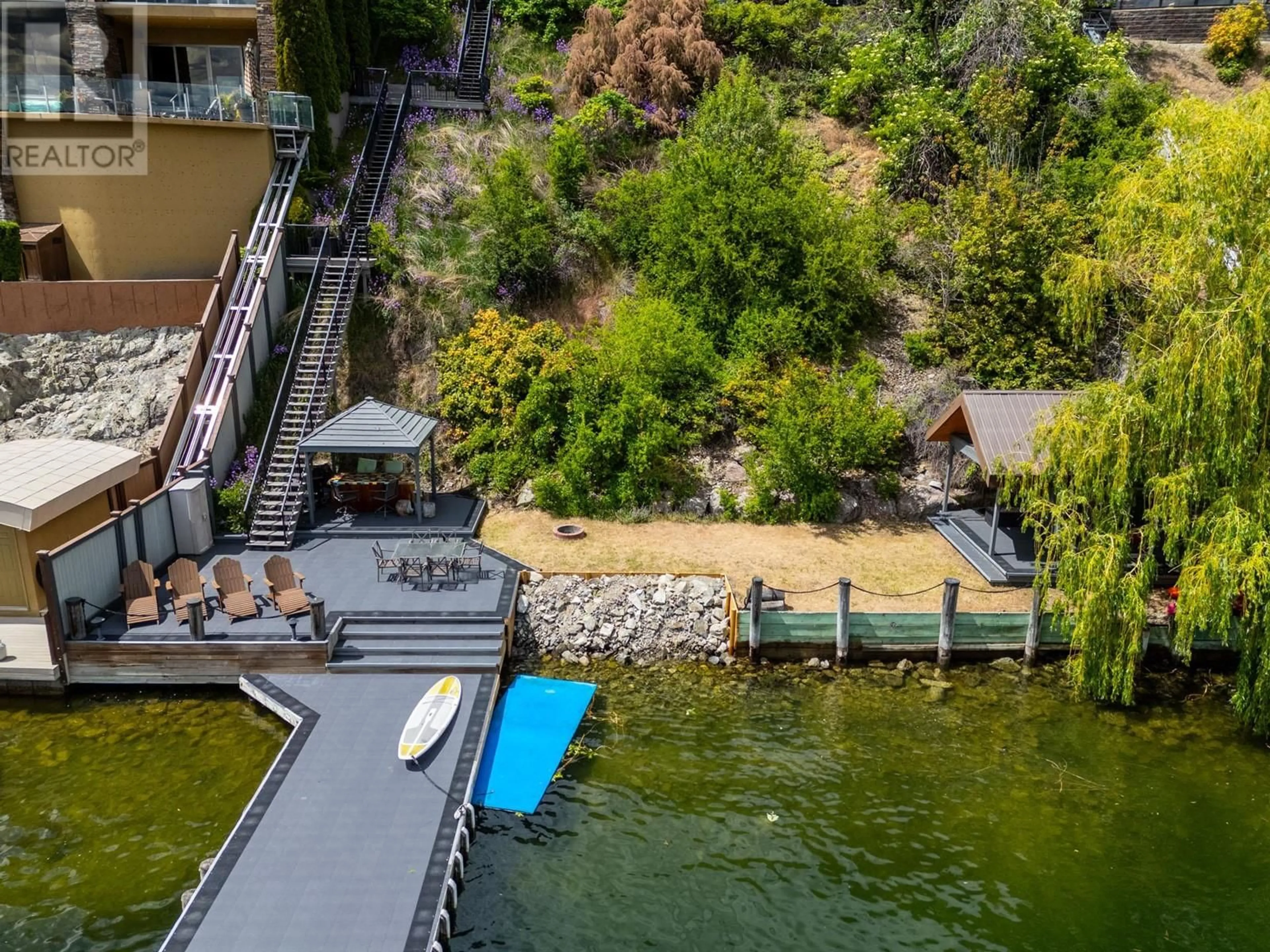 A pic from outside/outdoor area/front of a property/back of a property/a pic from drone, water/lake/river/ocean view for 7 - 901 WESTSIDE ROAD SOUTH, West Kelowna British Columbia V1Z3W9