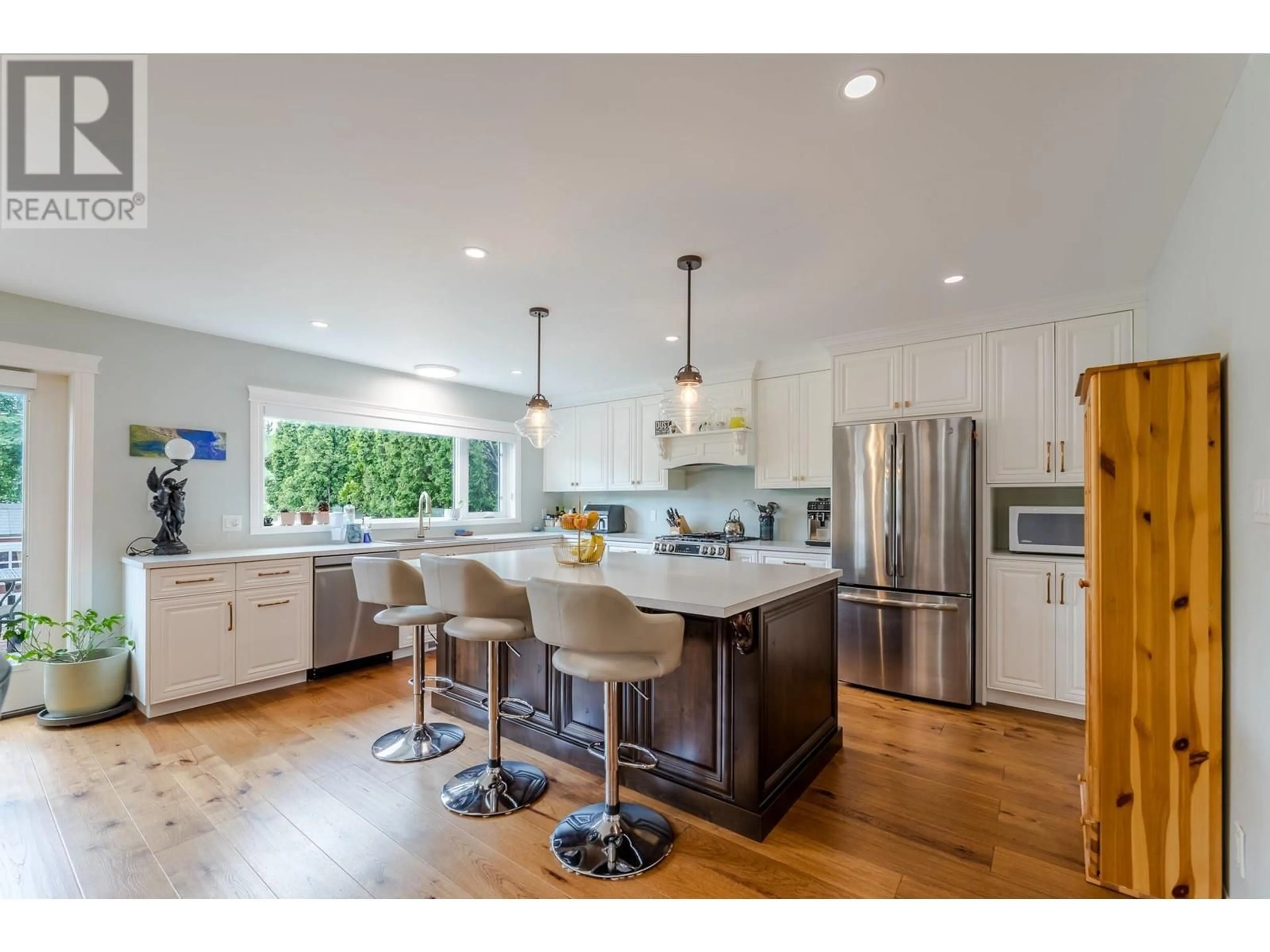 Open concept kitchen, wood/laminate floor for 10903 BARCLAY STREET, Summerland British Columbia V0H1Z0