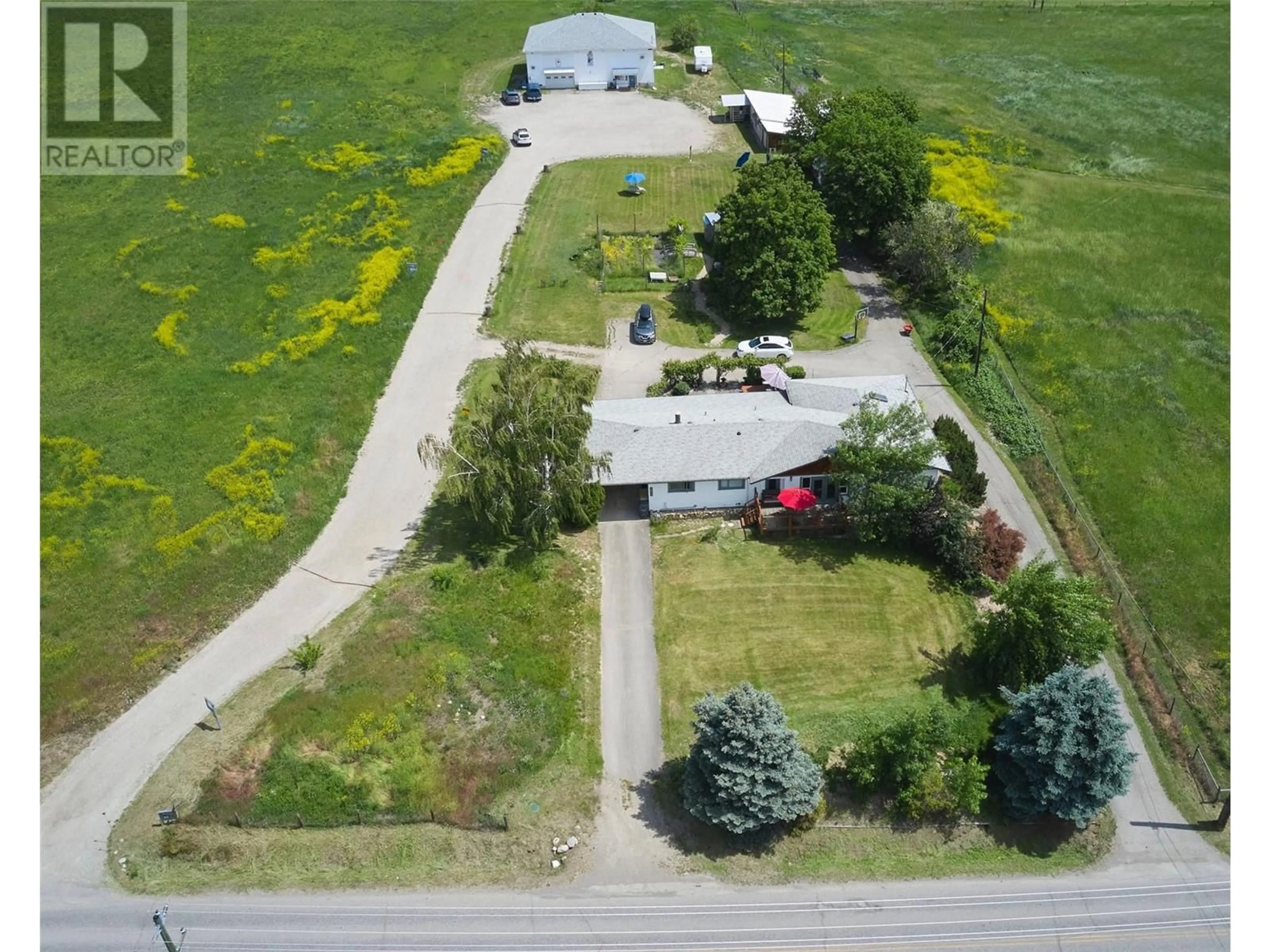 A pic from outside/outdoor area/front of a property/back of a property/a pic from drone, street for 2515 EAST VERNON ROAD, Vernon British Columbia V1B3H5