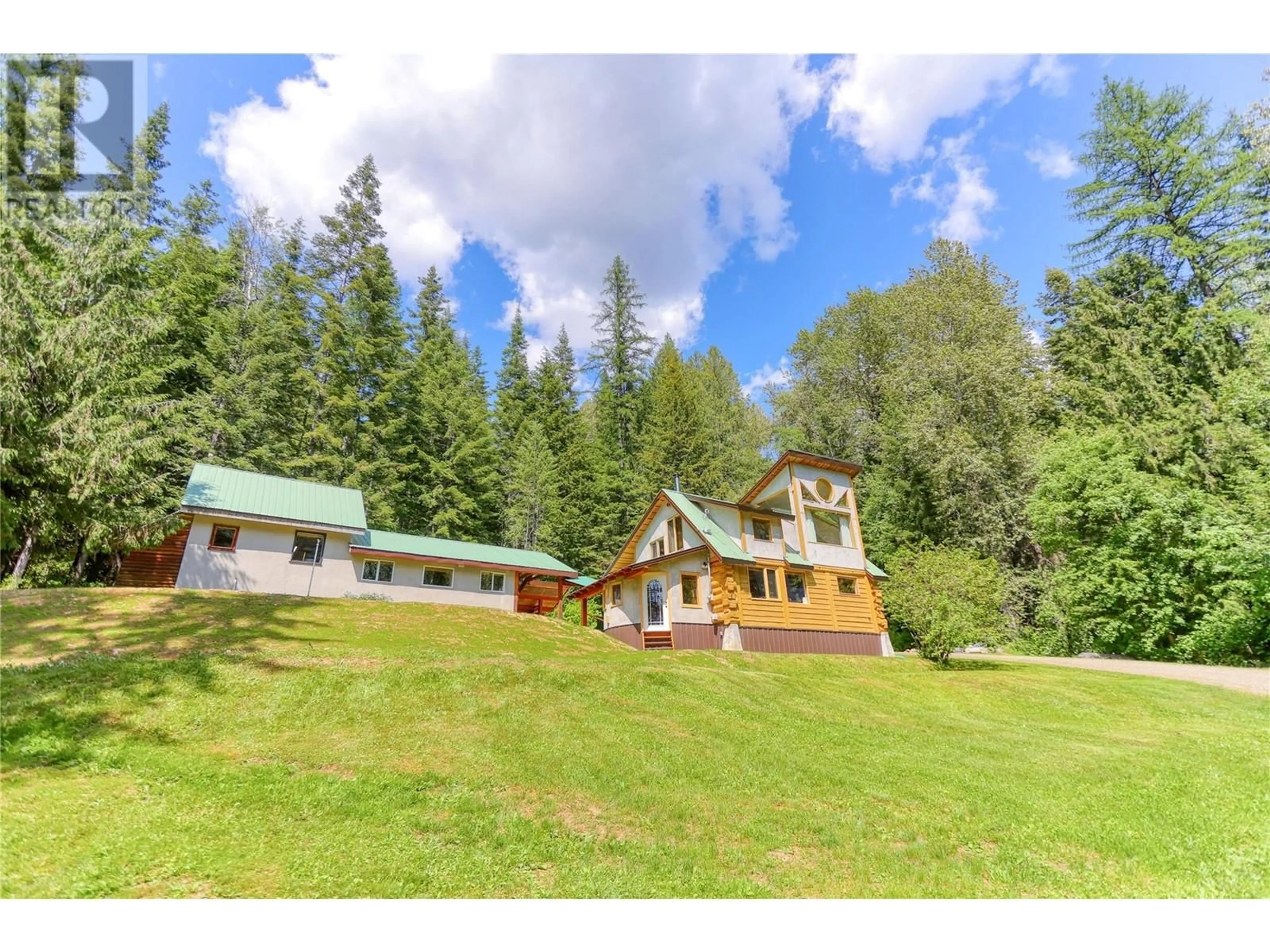 A pic from outside/outdoor area/front of a property/back of a property/a pic from drone, mountain view for 926 WILDHORSE CREEK ROAD, Ymir British Columbia V0G2K0