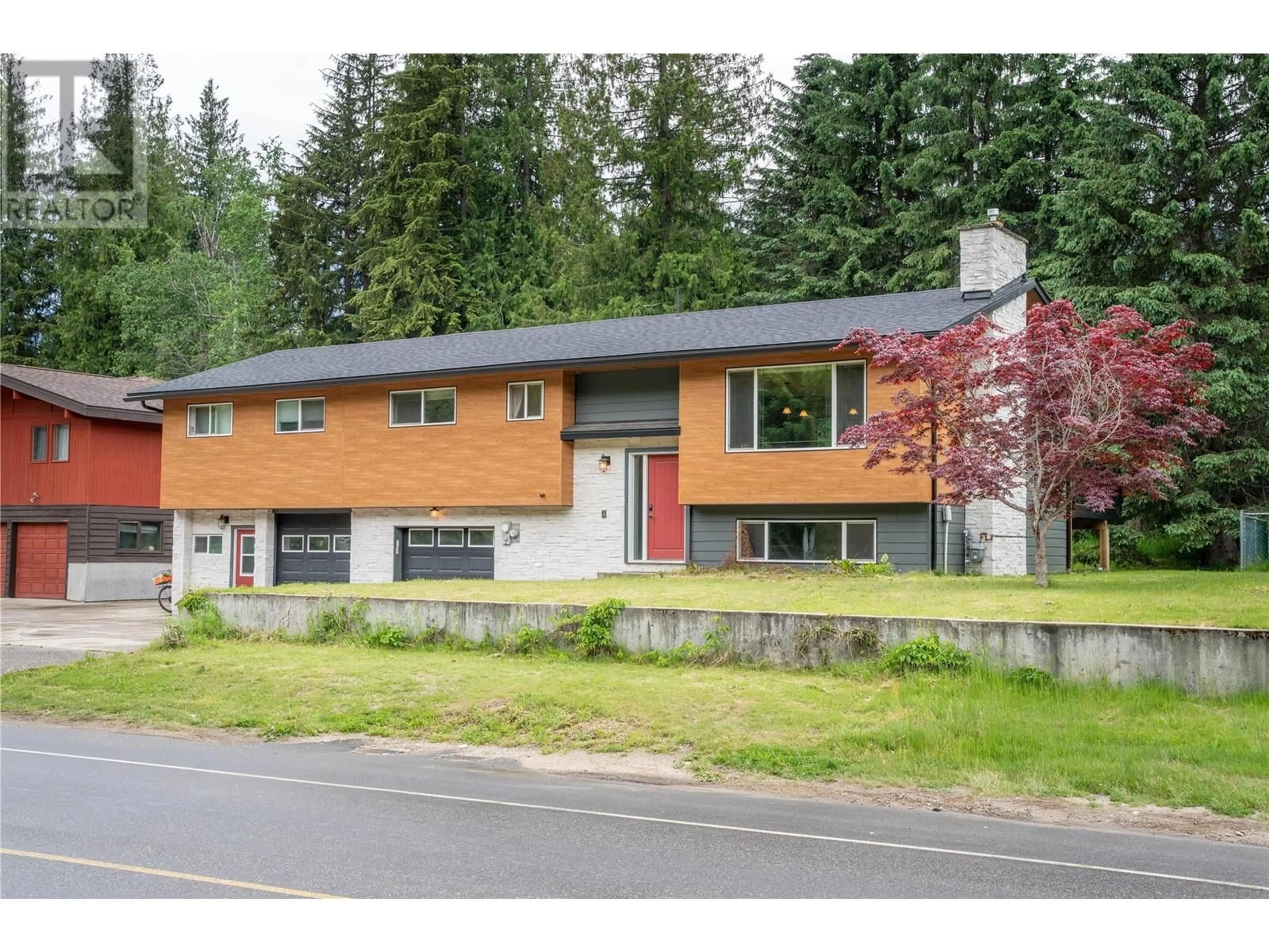 Home with vinyl exterior material, street for 109 COLBECK ROAD, Revelstoke British Columbia V0E2S0