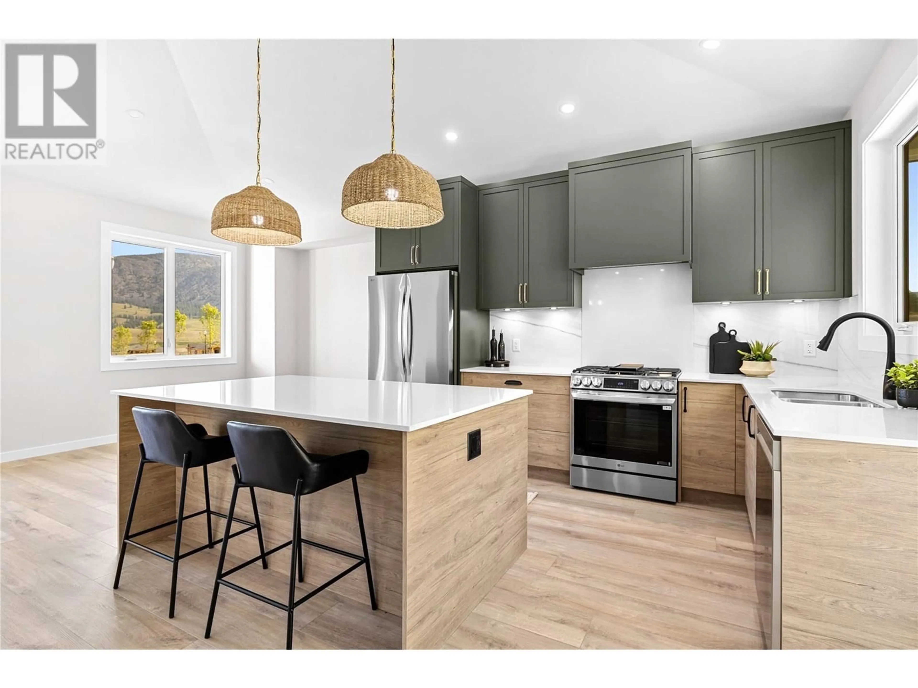 Open concept kitchen, wood/laminate floor for 2075 CORTINA DRIVE, Kelowna British Columbia V1P1E1