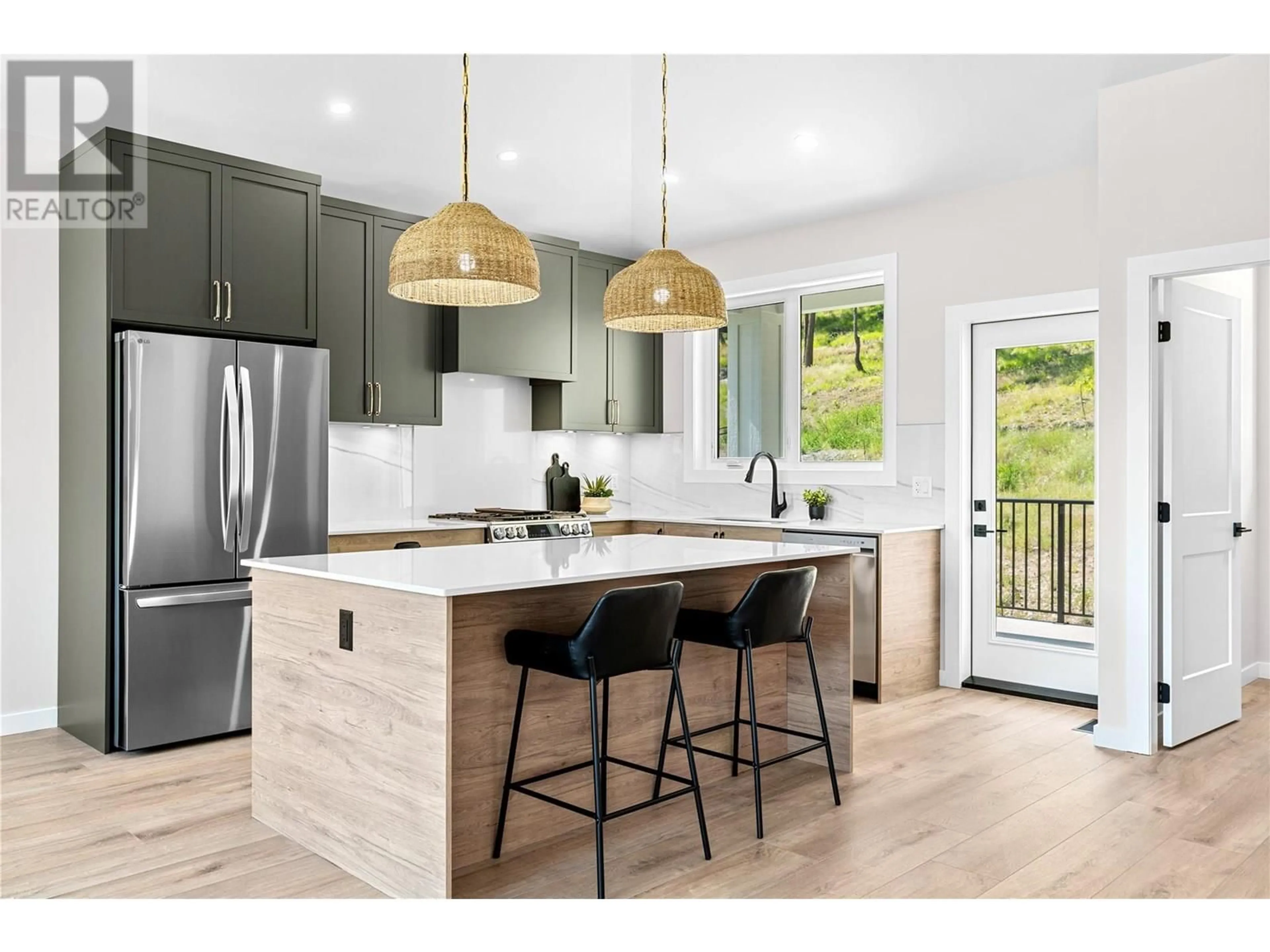 Open concept kitchen, wood/laminate floor for 2075 CORTINA DRIVE, Kelowna British Columbia V1P1E1