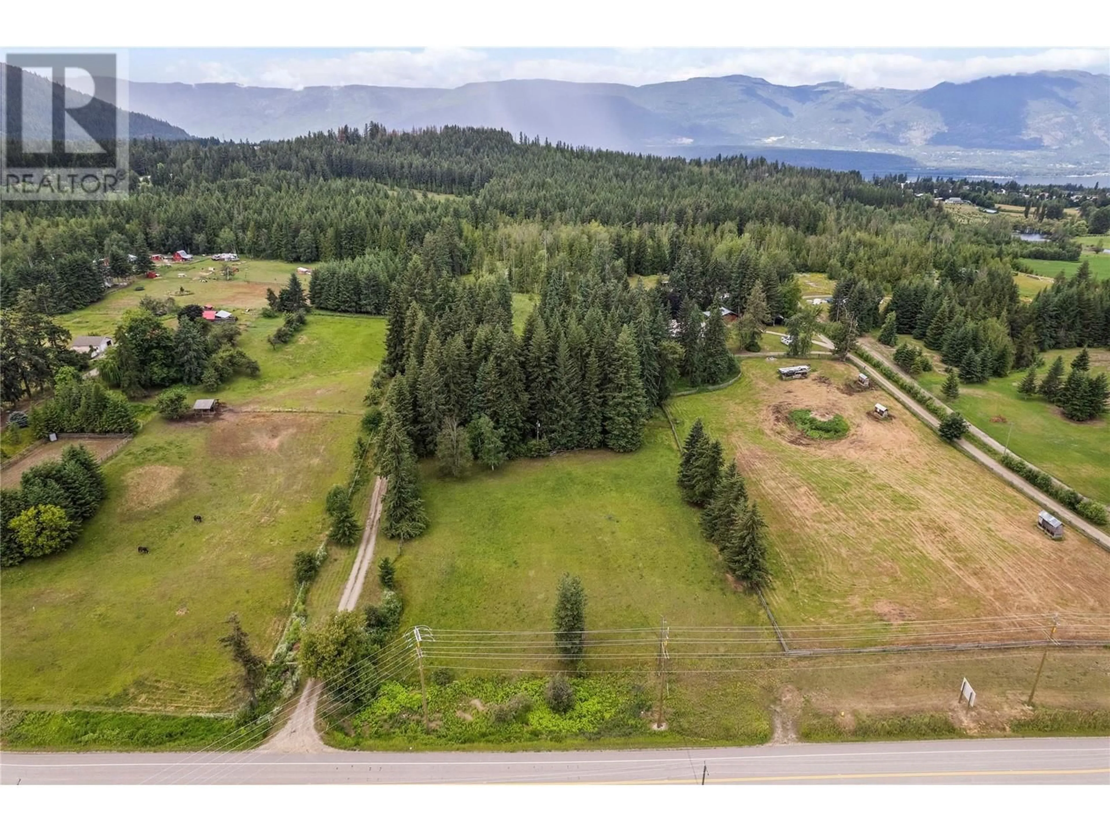 A pic from outside/outdoor area/front of a property/back of a property/a pic from drone, mountain view for 461 HIGHWAY 97B OTHER SOUTHEAST, Salmon Arm British Columbia V1E1X5