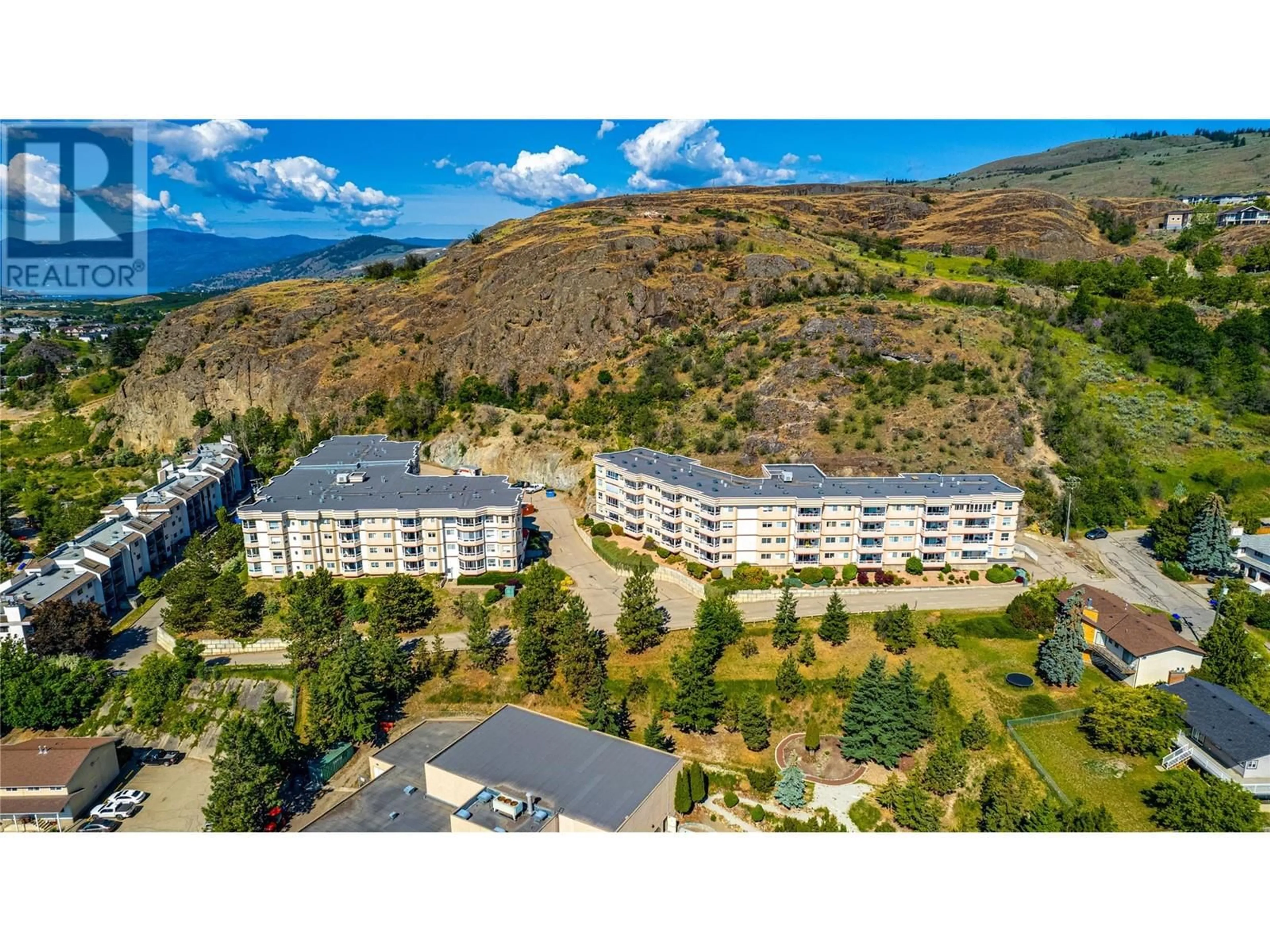 A pic from outside/outdoor area/front of a property/back of a property/a pic from drone, mountain view for 407 - 3806 35 AVENUE, Vernon British Columbia V1T9N6