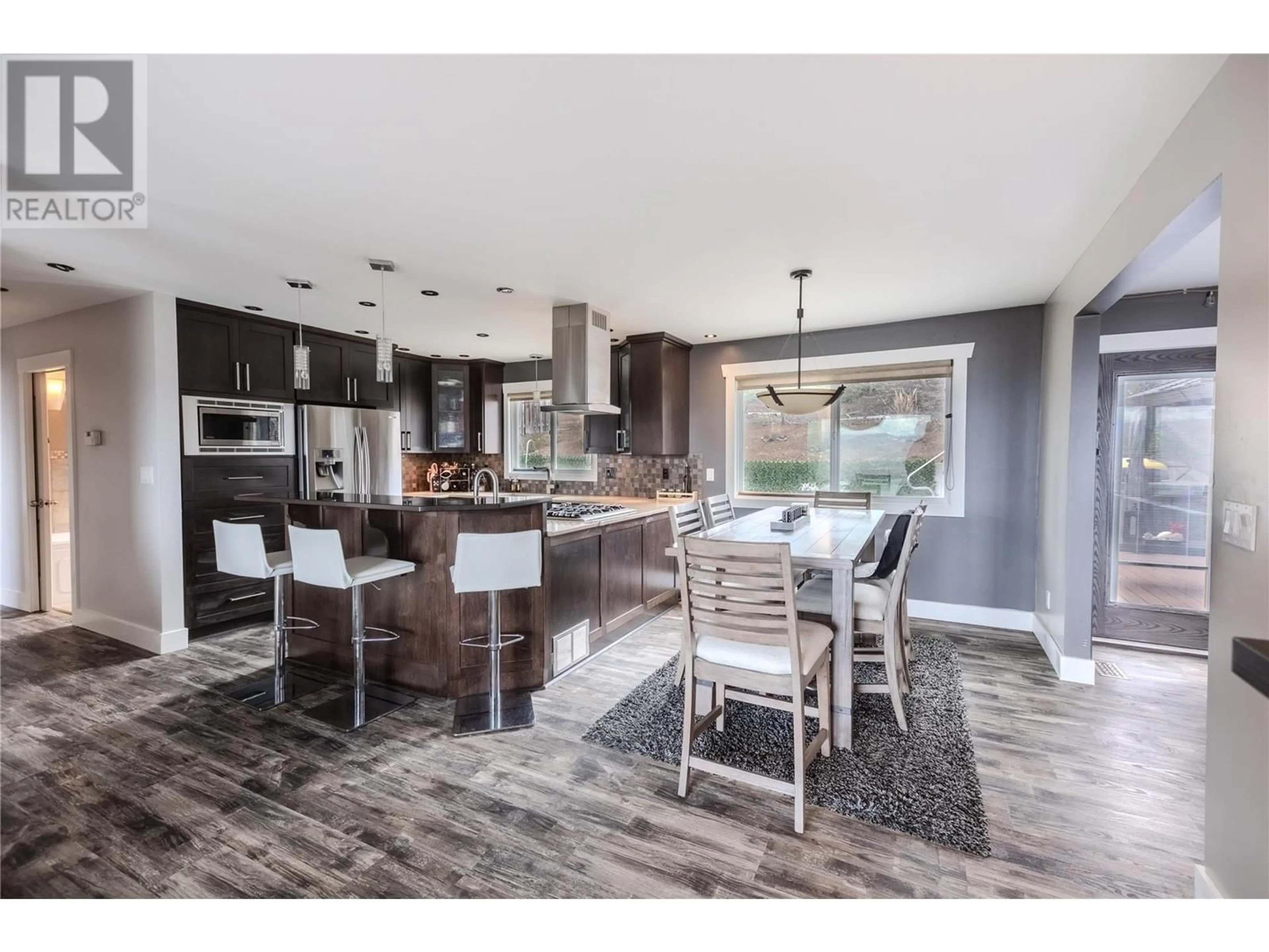 Open concept kitchen, wood/laminate floor for 878 GLENEAGLES DRIVE, Kamloops British Columbia V2E1K3