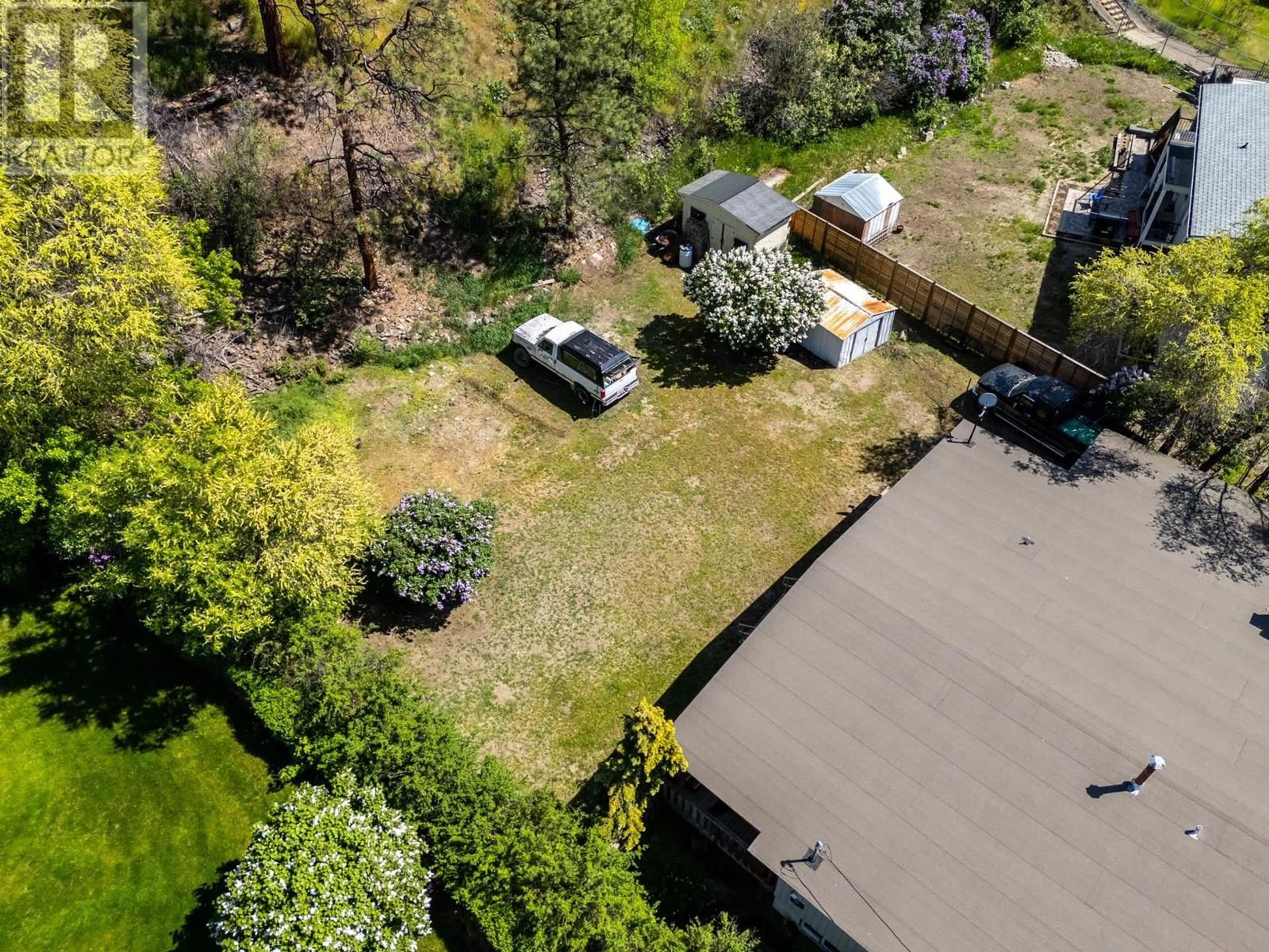 A pic from outside/outdoor area/front of a property/back of a property/a pic from drone, street for 605 DELL ROAD, Kelowna British Columbia V1X3P7