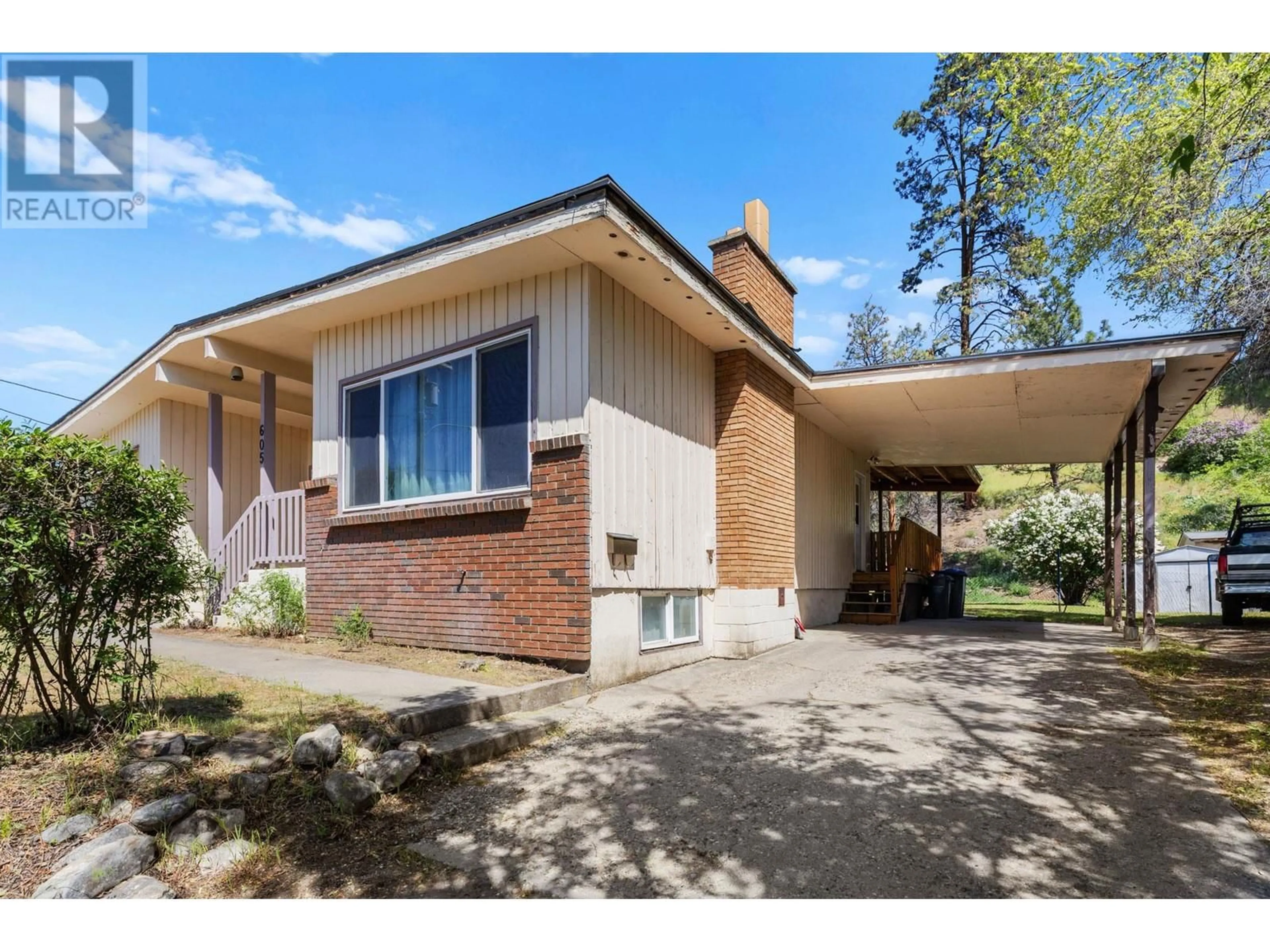 Home with brick exterior material, street for 605 DELL ROAD, Kelowna British Columbia V1X3P7