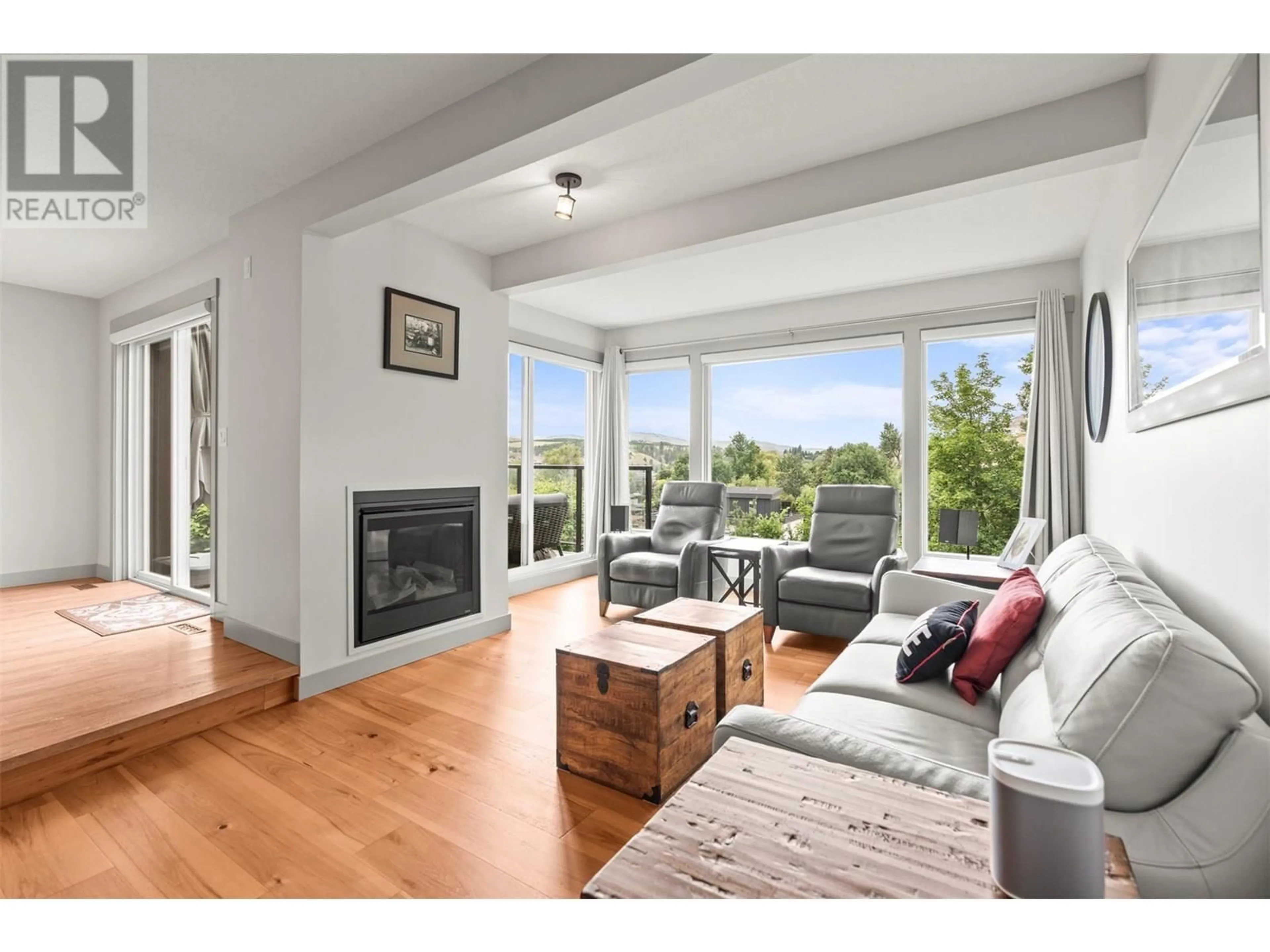 Living room with furniture, wood/laminate floor for 5 - 7880 KIDSTON ROAD, Coldstream British Columbia V1B1S2