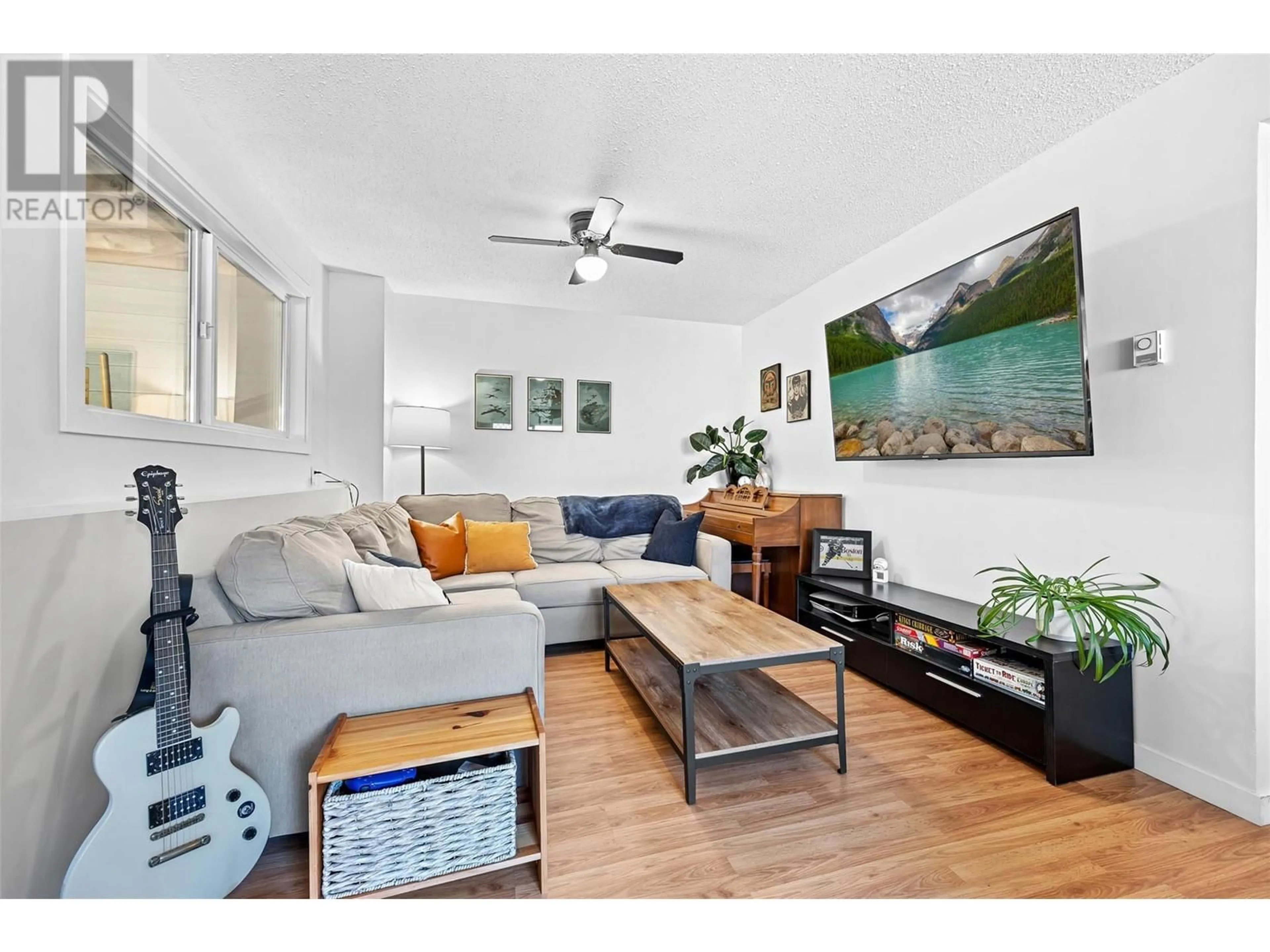 Living room with furniture, wood/laminate floor for 2942 MCCANN COURT, West Kelowna British Columbia V4T1G9