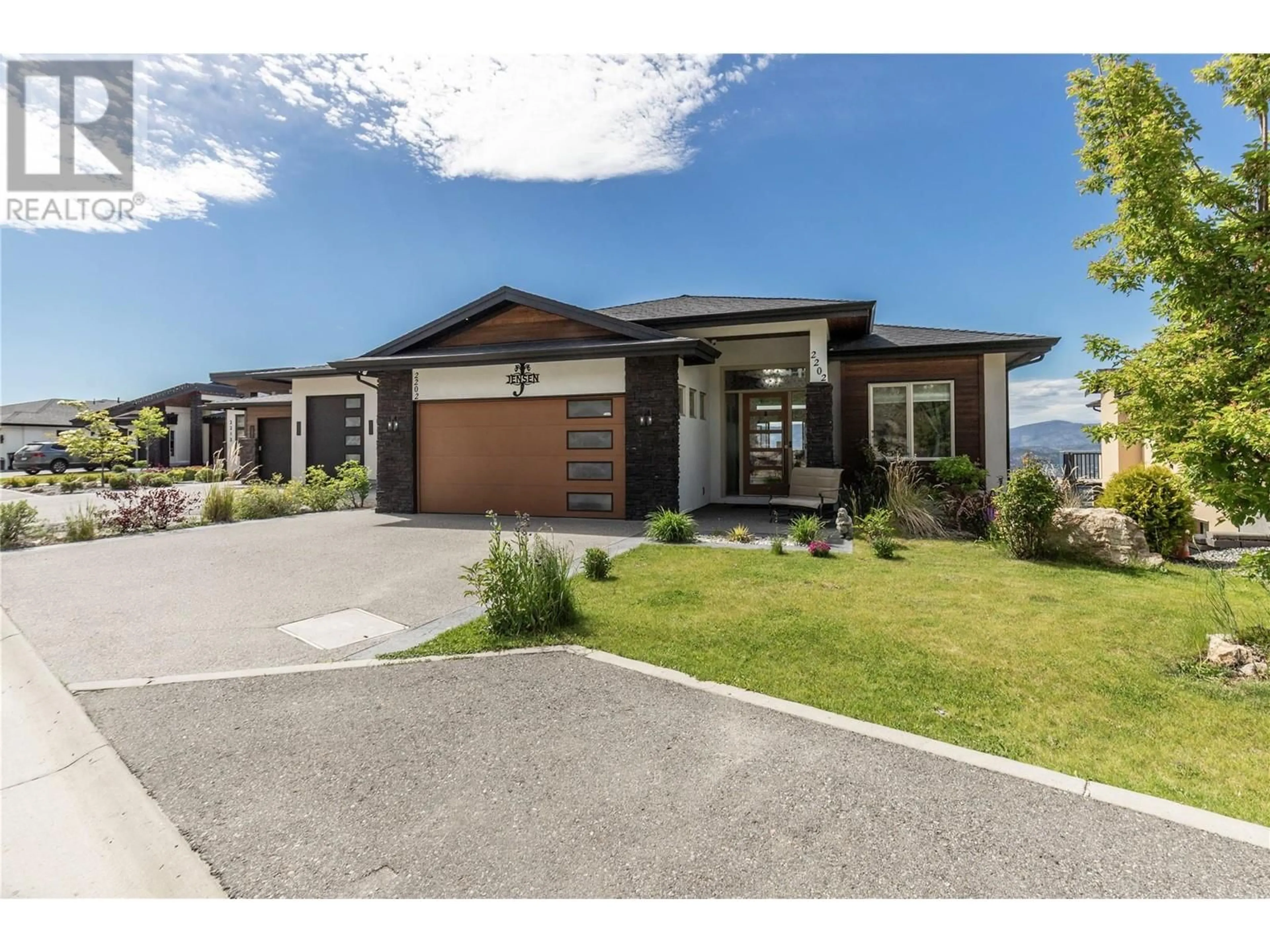 Home with brick exterior material, street for 2202 TRAMONTO COURT, Kelowna British Columbia V1P1V1