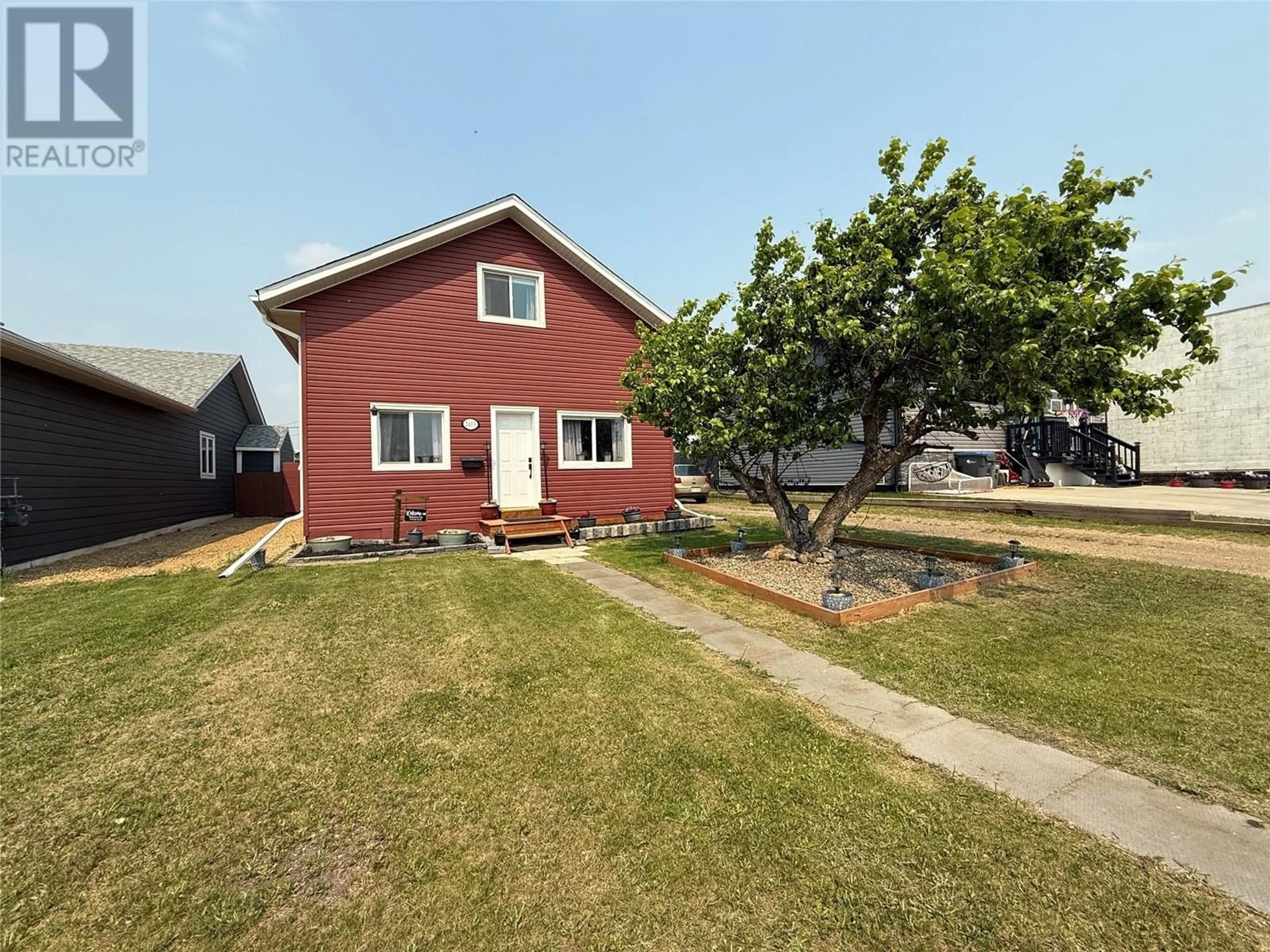 A pic from outside/outdoor area/front of a property/back of a property/a pic from drone, street for 1408 101 AVENUE, Dawson Creek British Columbia V1G2A5