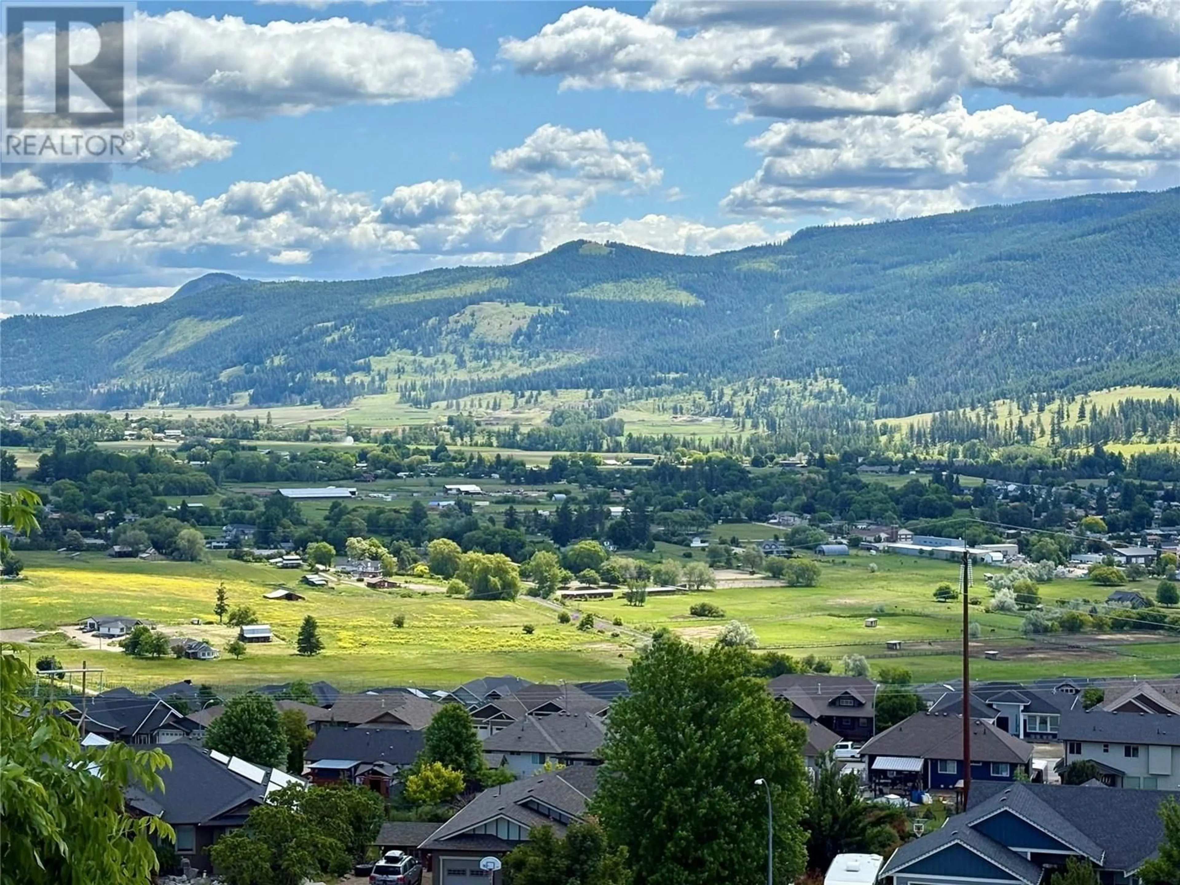 A pic from outside/outdoor area/front of a property/back of a property/a pic from drone, mountain view for 592 MT IDA CRESCENT, Coldstream British Columbia V1B4G3