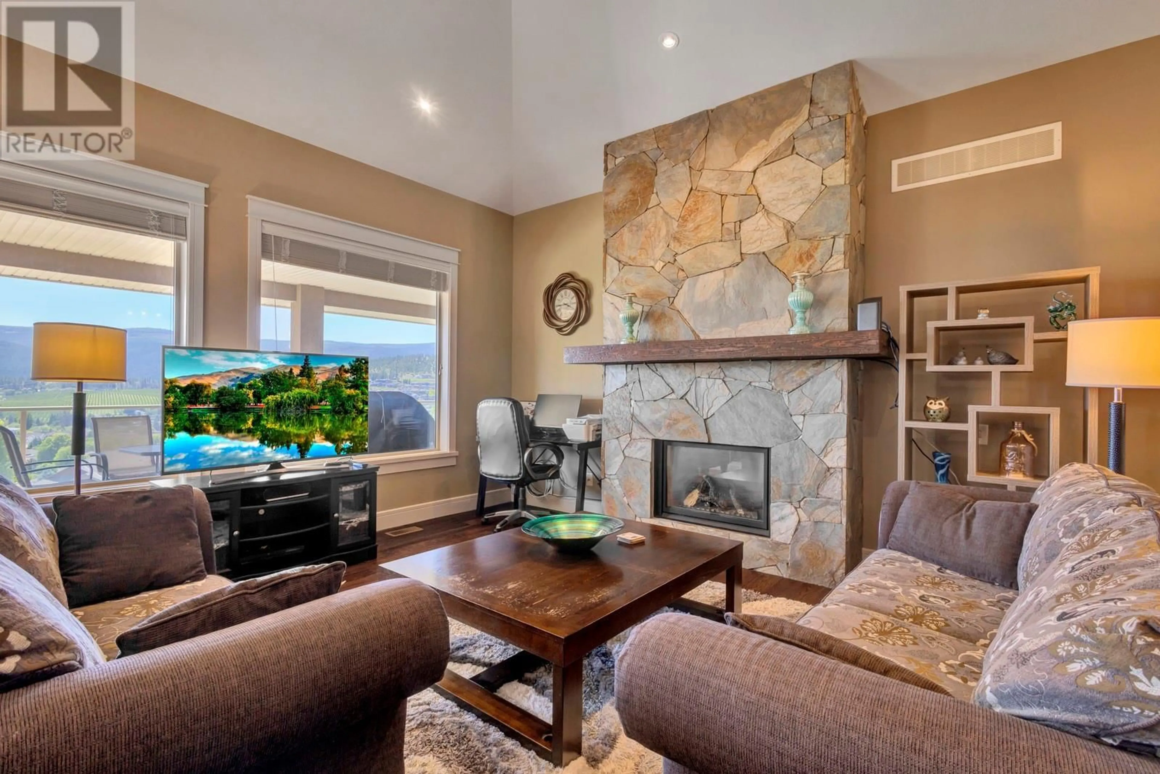 Living room with furniture, ceramic/tile floor for 1205 LOSETH DRIVE, Kelowna British Columbia V1P1S2