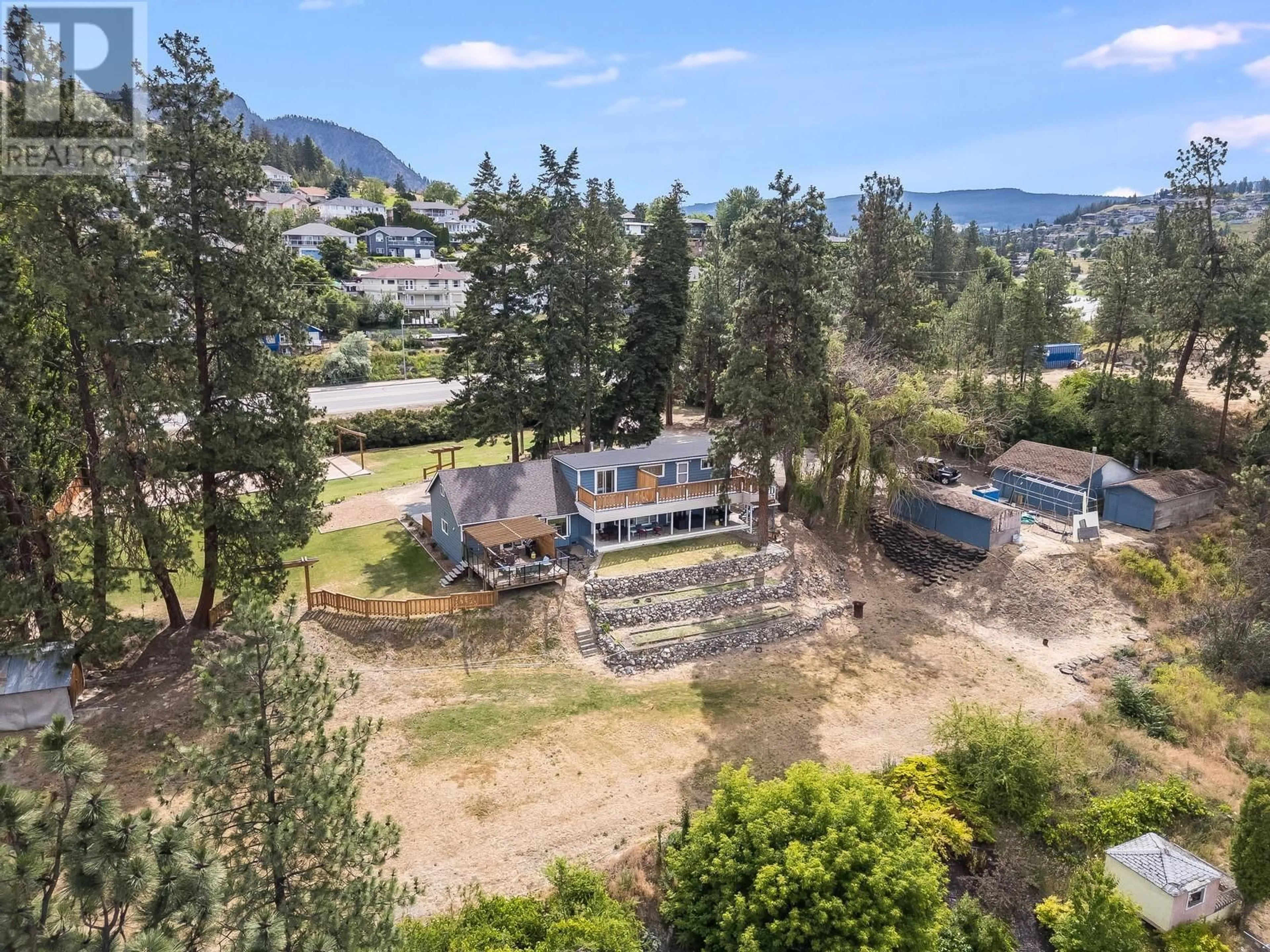 A pic from outside/outdoor area/front of a property/back of a property/a pic from drone, mountain view for 1293 HIGHWAY 33 OTHER EAST, Kelowna British Columbia V1P1M1