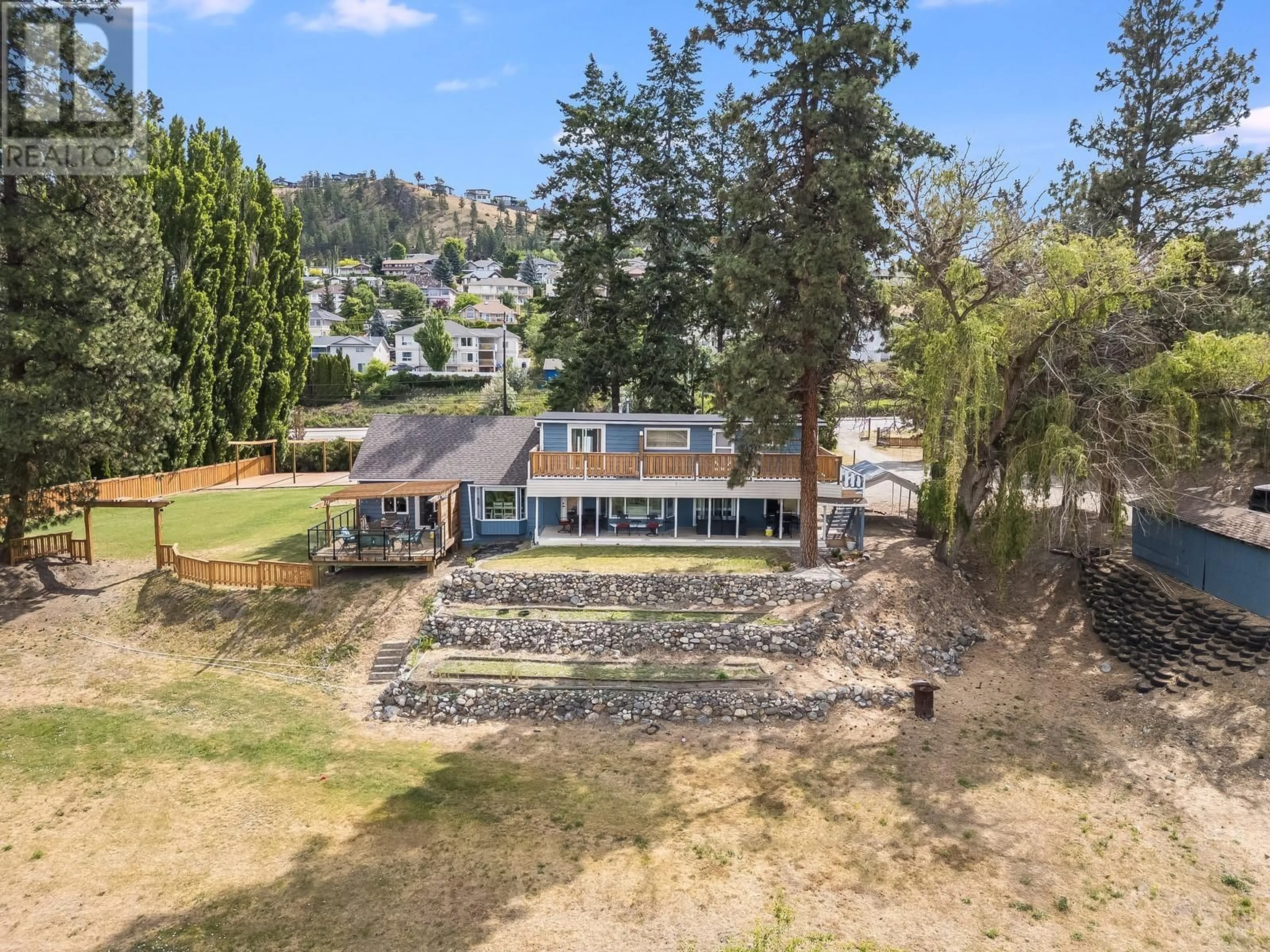 A pic from outside/outdoor area/front of a property/back of a property/a pic from drone, mountain view for 1293 HIGHWAY 33 OTHER EAST, Kelowna British Columbia V1P1M1