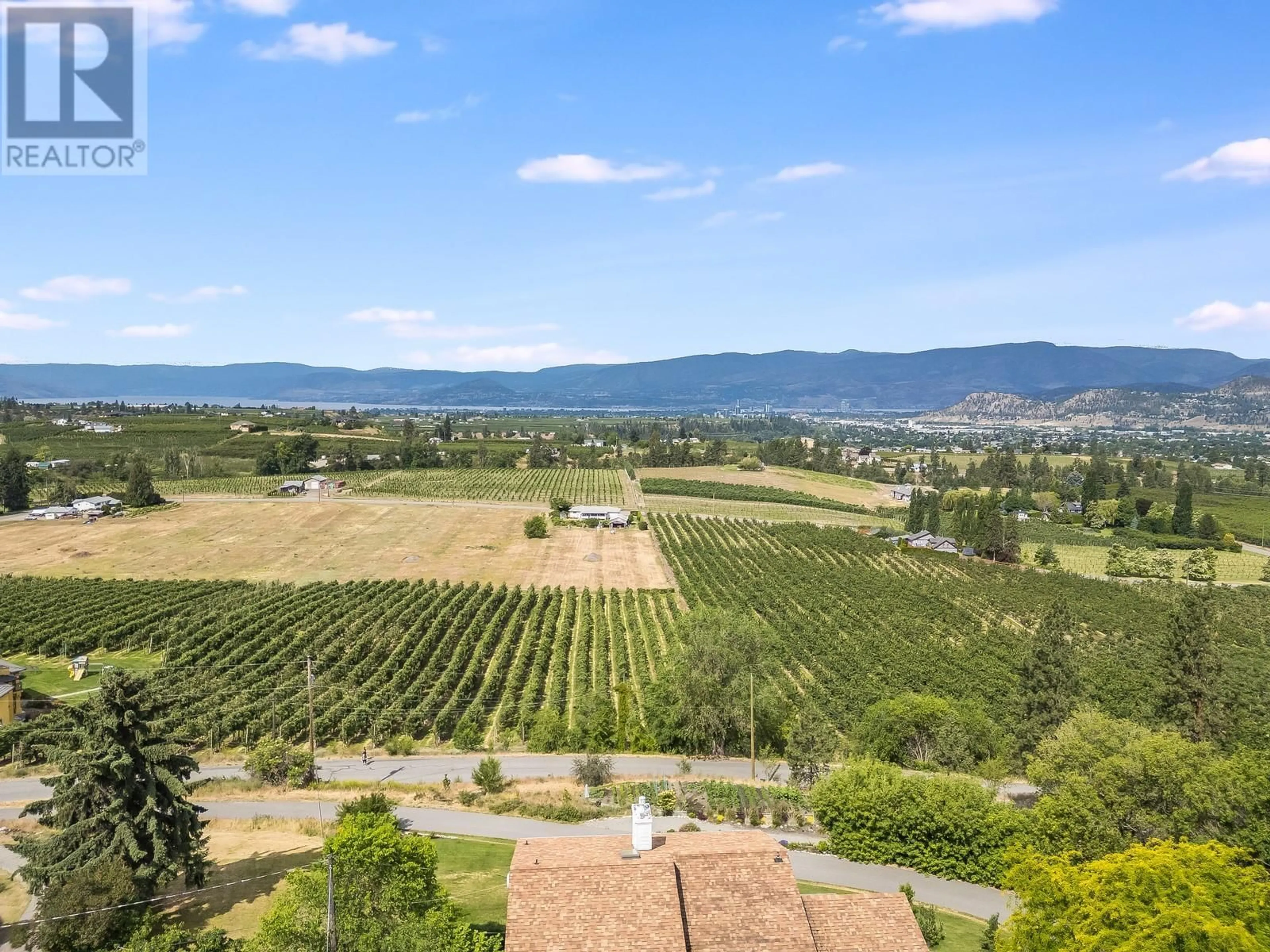 A pic from outside/outdoor area/front of a property/back of a property/a pic from drone, mountain view for 1293 HIGHWAY 33 OTHER EAST, Kelowna British Columbia V1P1M1