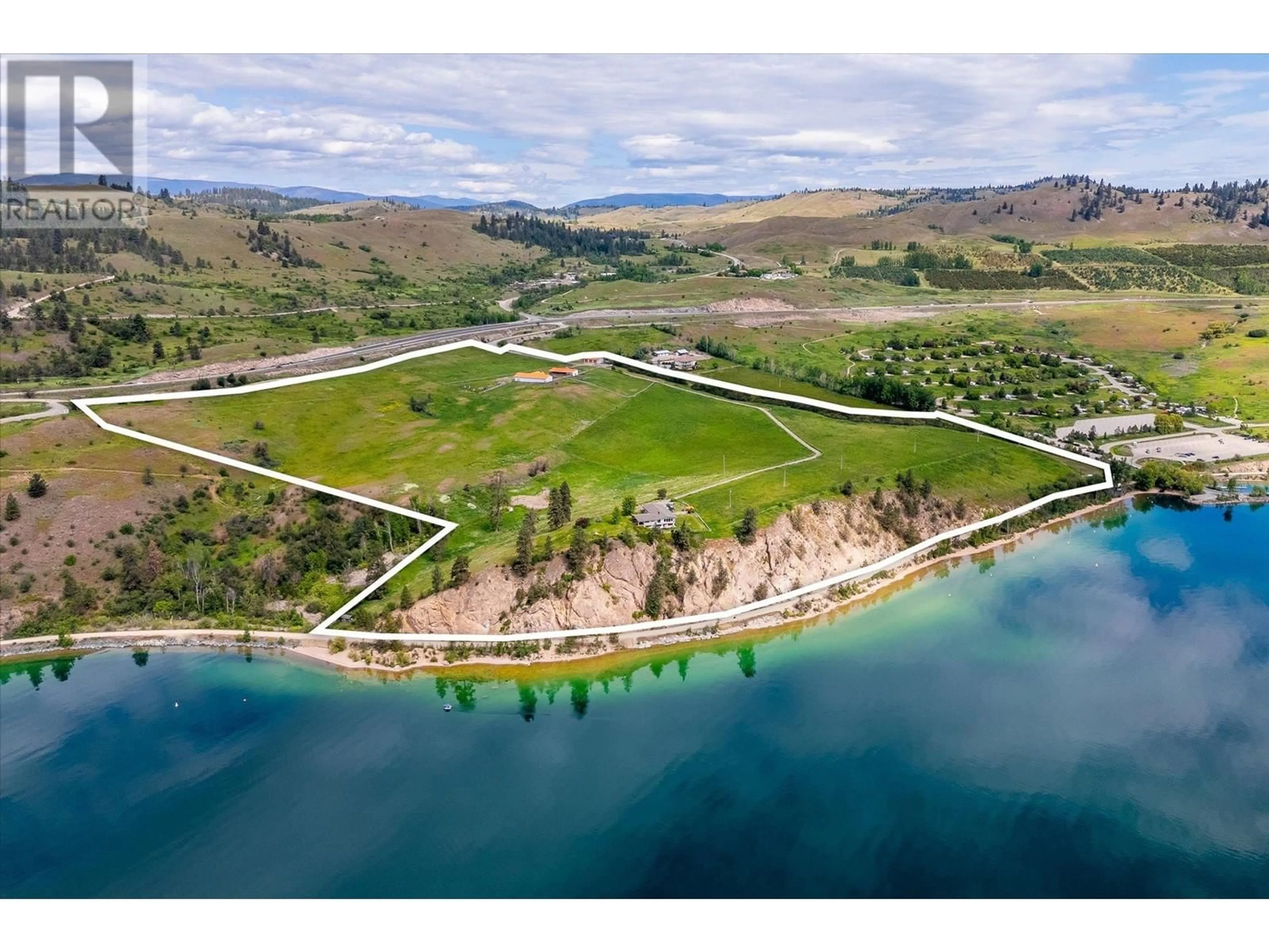 A pic from outside/outdoor area/front of a property/back of a property/a pic from drone, water/lake/river/ocean view for 201 HIGHWAY 97 OTHER, Vernon British Columbia V1H1G1