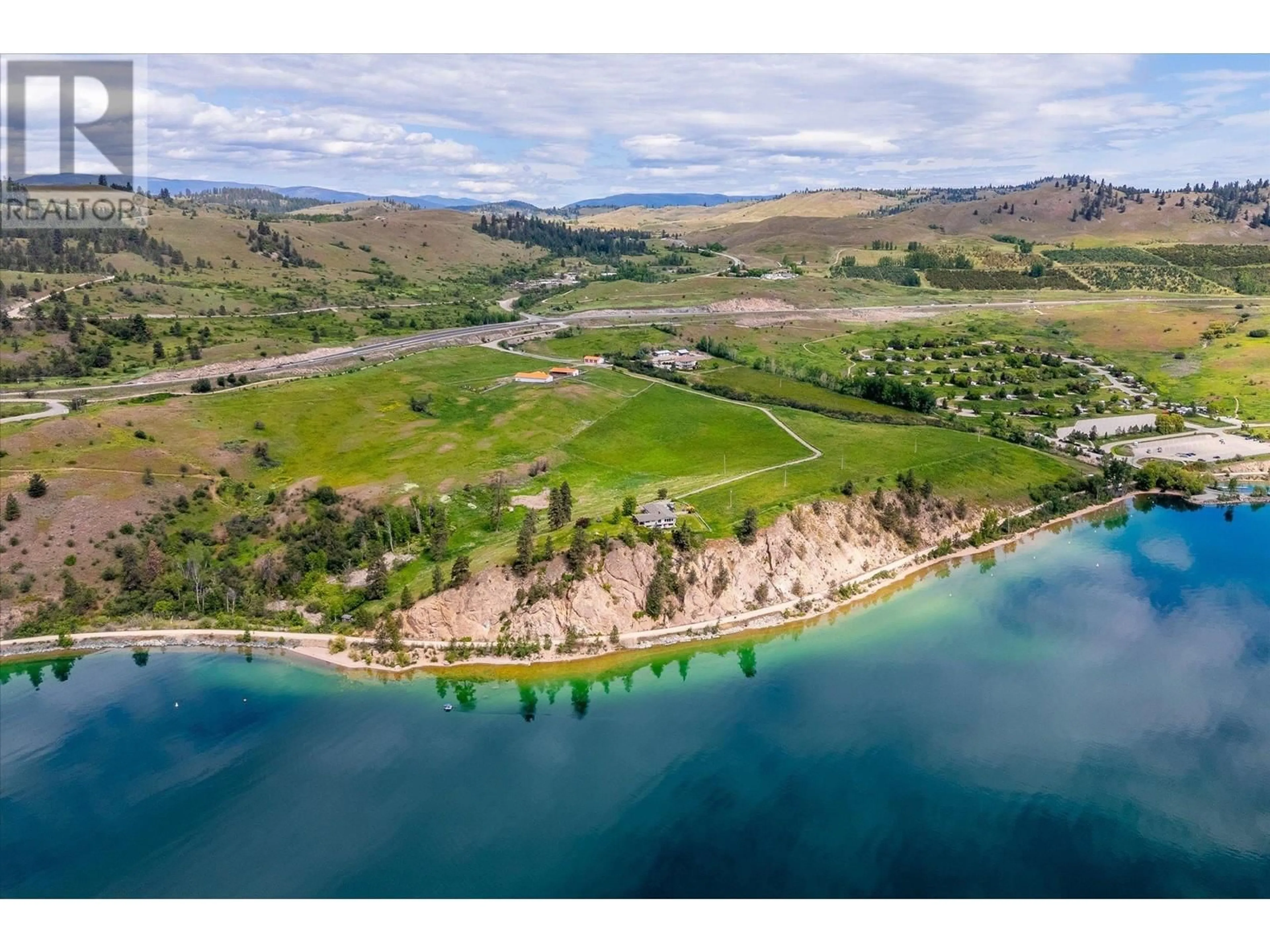 A pic from outside/outdoor area/front of a property/back of a property/a pic from drone, water/lake/river/ocean view for 201 HIGHWAY 97 OTHER, Vernon British Columbia V1H1G1