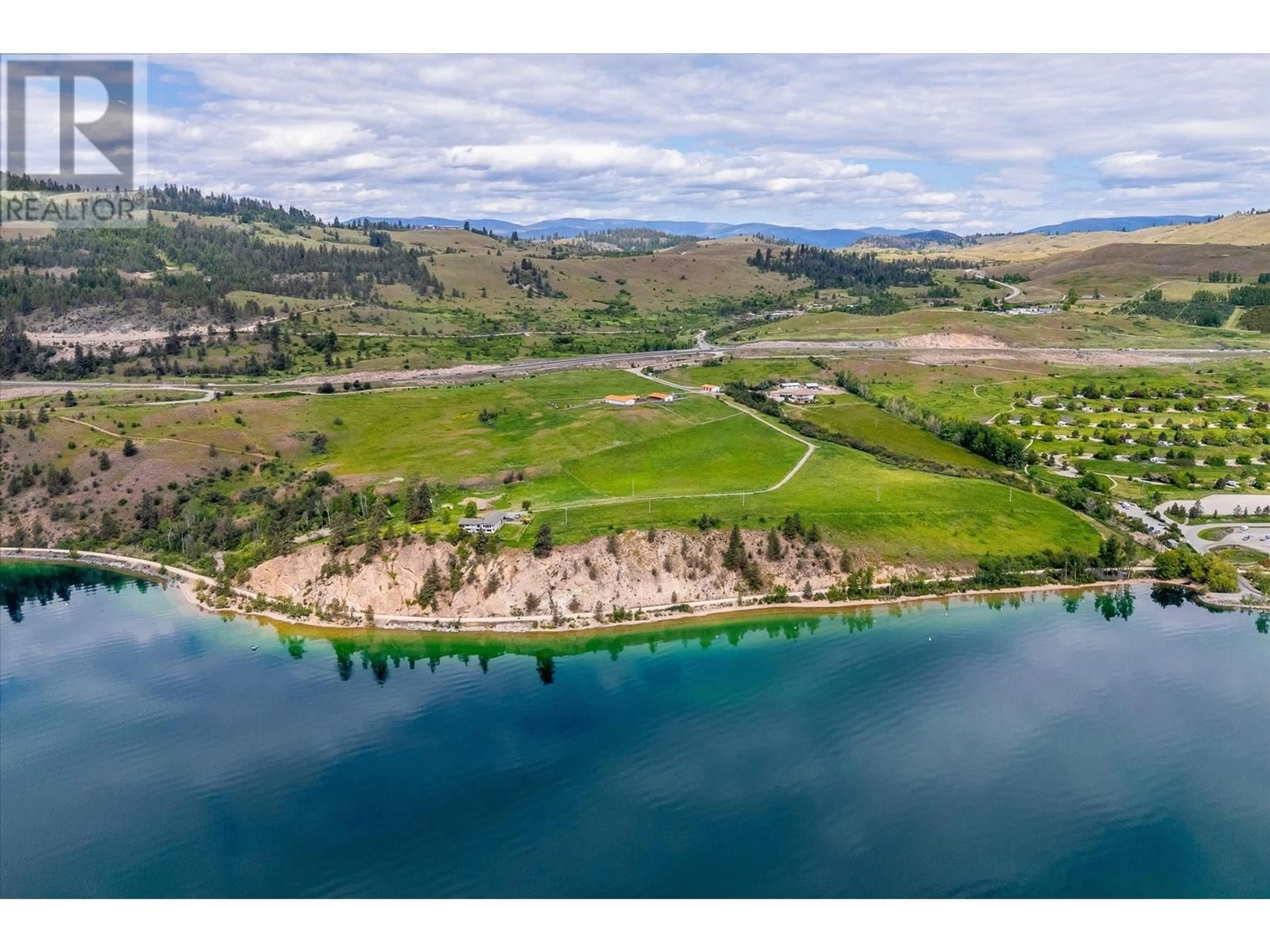 A pic from outside/outdoor area/front of a property/back of a property/a pic from drone, water/lake/river/ocean view for 201 HIGHWAY 97 OTHER, Vernon British Columbia V1H1G1