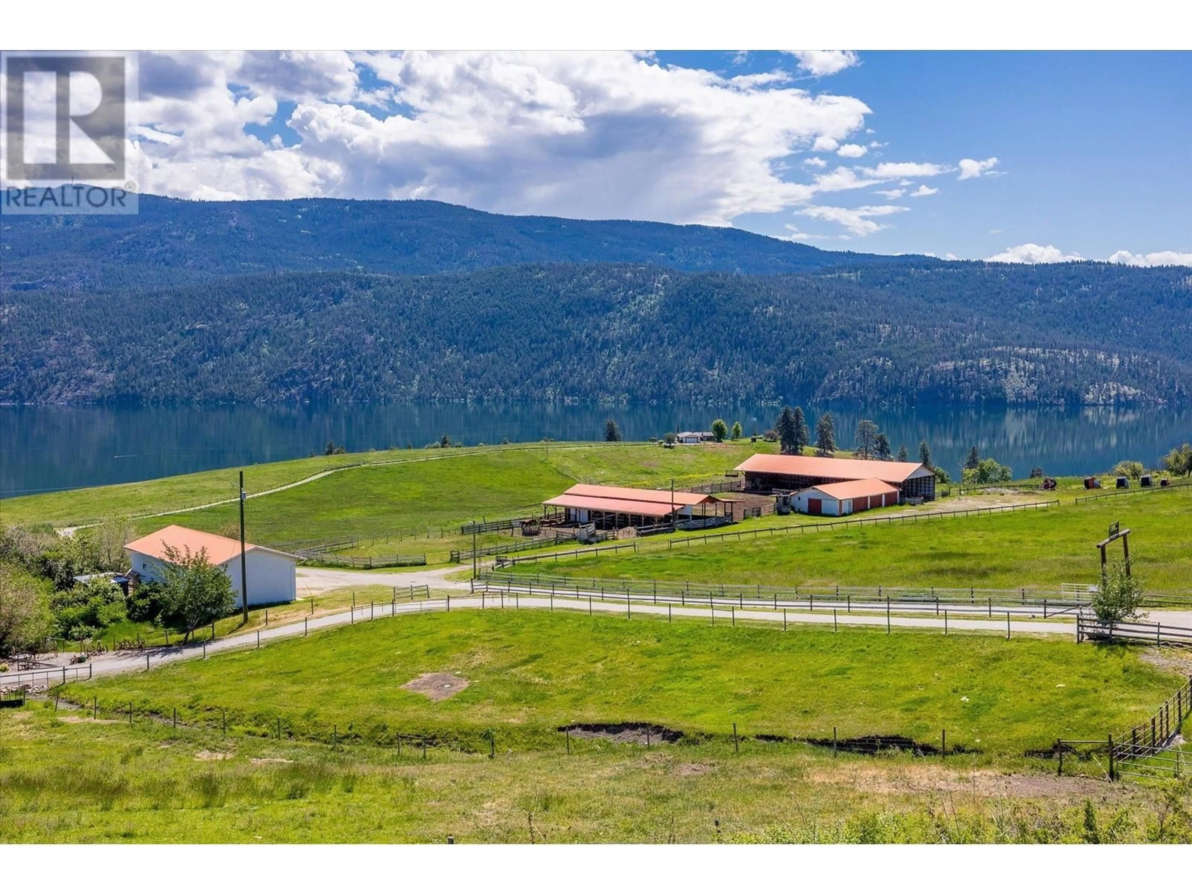 A pic from outside/outdoor area/front of a property/back of a property/a pic from drone, mountain view for 201 HIGHWAY 97 OTHER, Vernon British Columbia V1H1G1