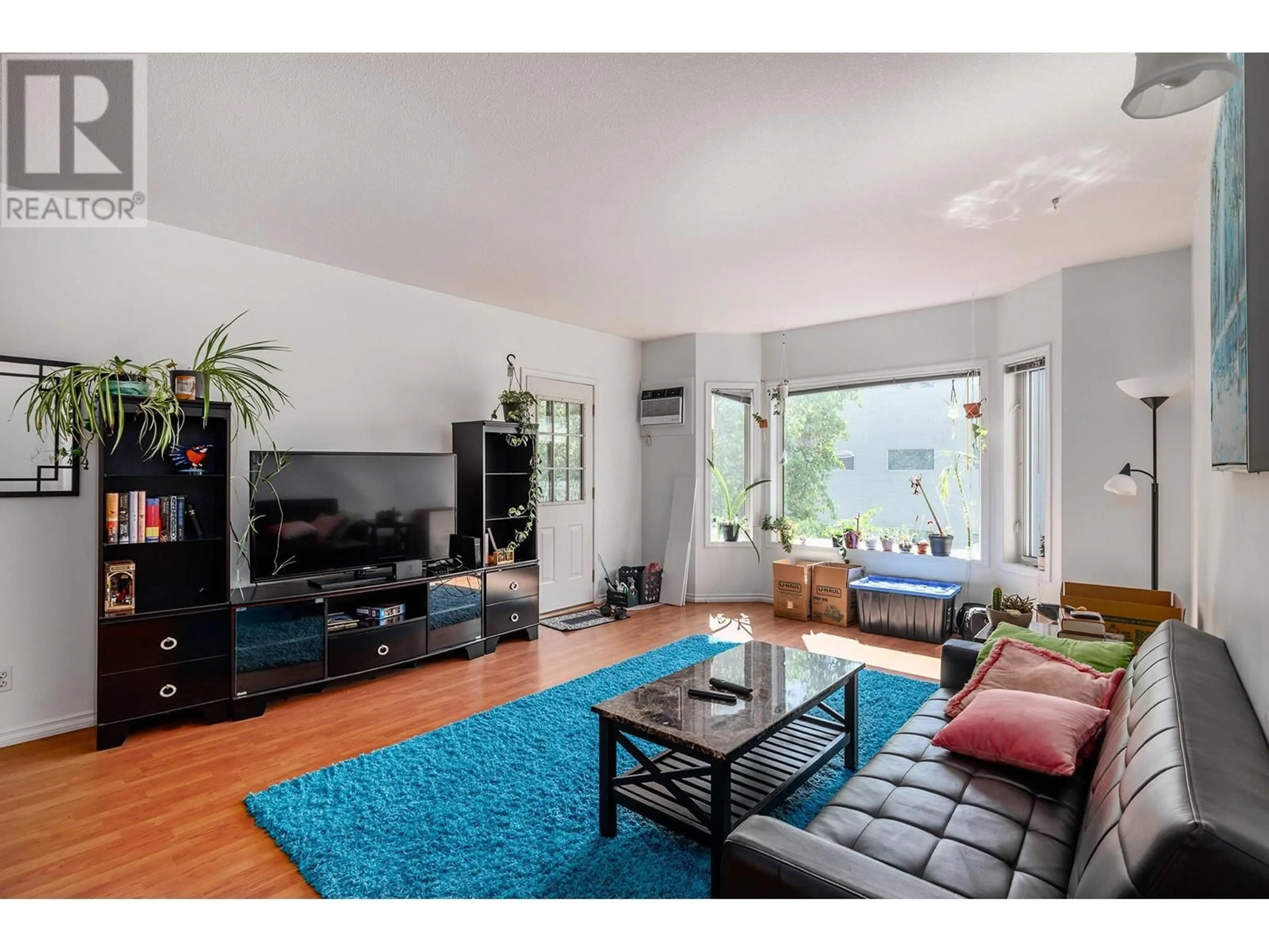 Living room with furniture, unknown for 214 - 985 KLO ROAD, Kelowna British Columbia V1Y9L2