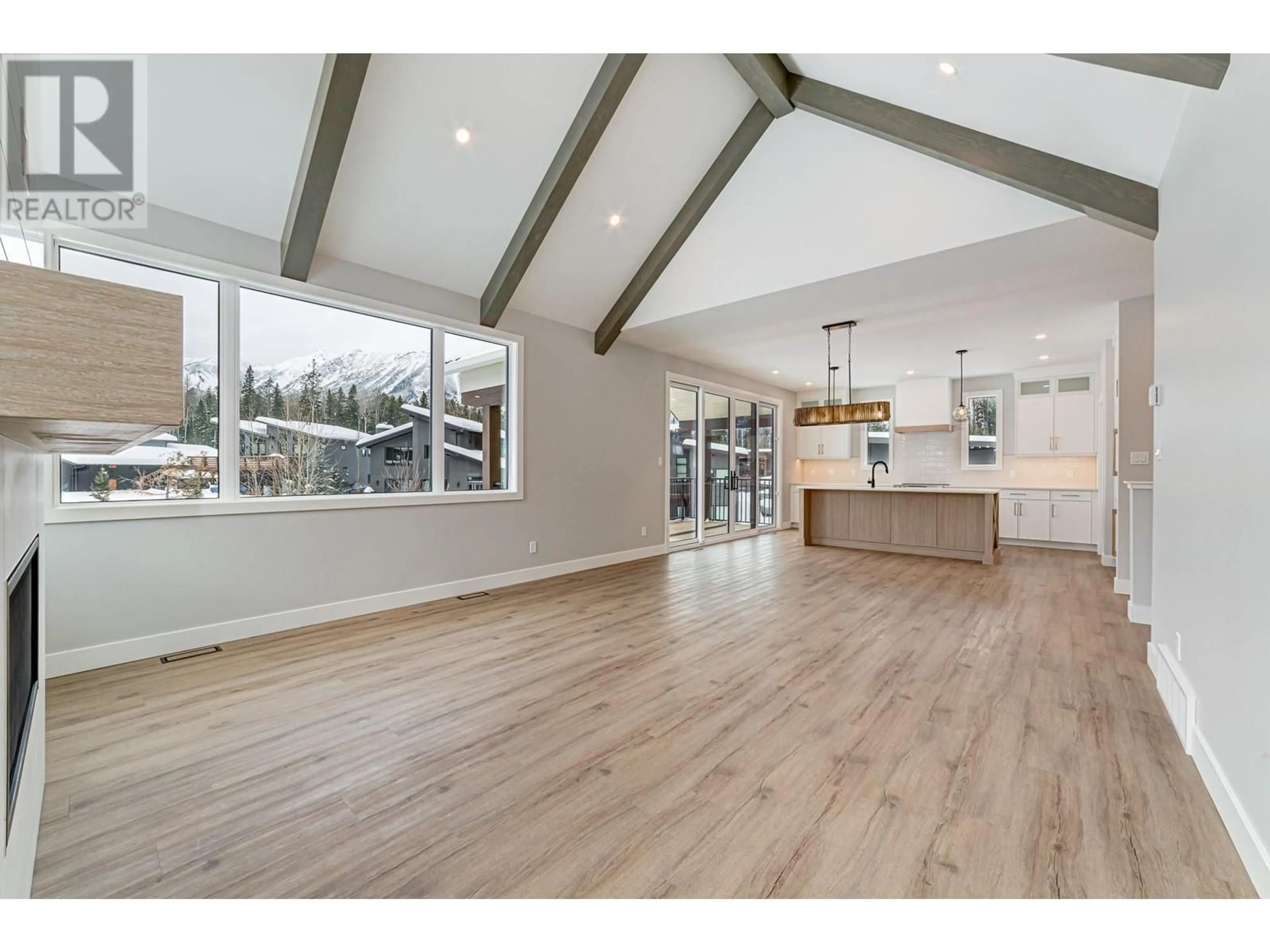 Open concept kitchen, wood/laminate floor for 6 HUCKLEBERRY PLACE, Fernie British Columbia V0B1M1