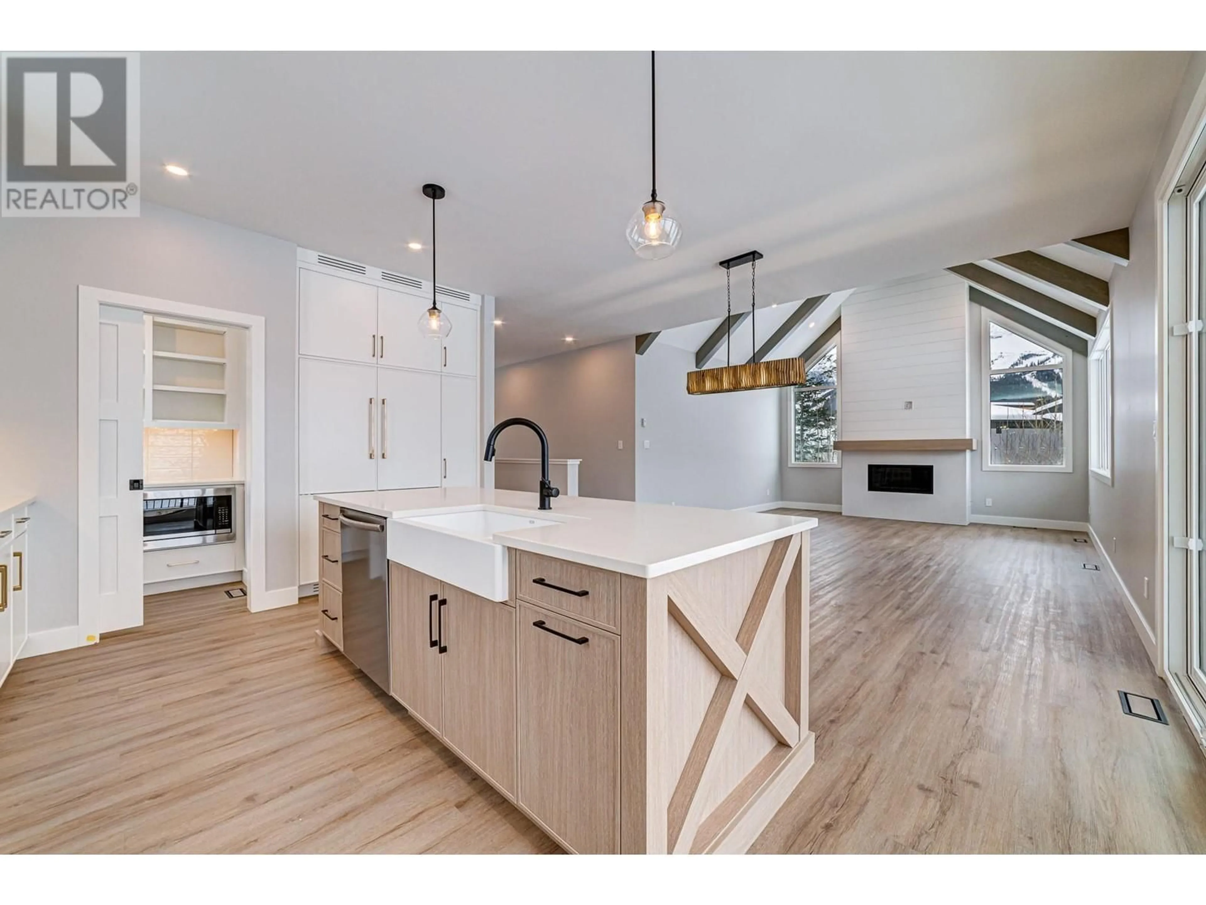 Open concept kitchen, wood/laminate floor for 6 HUCKLEBERRY PLACE, Fernie British Columbia V0B1M1