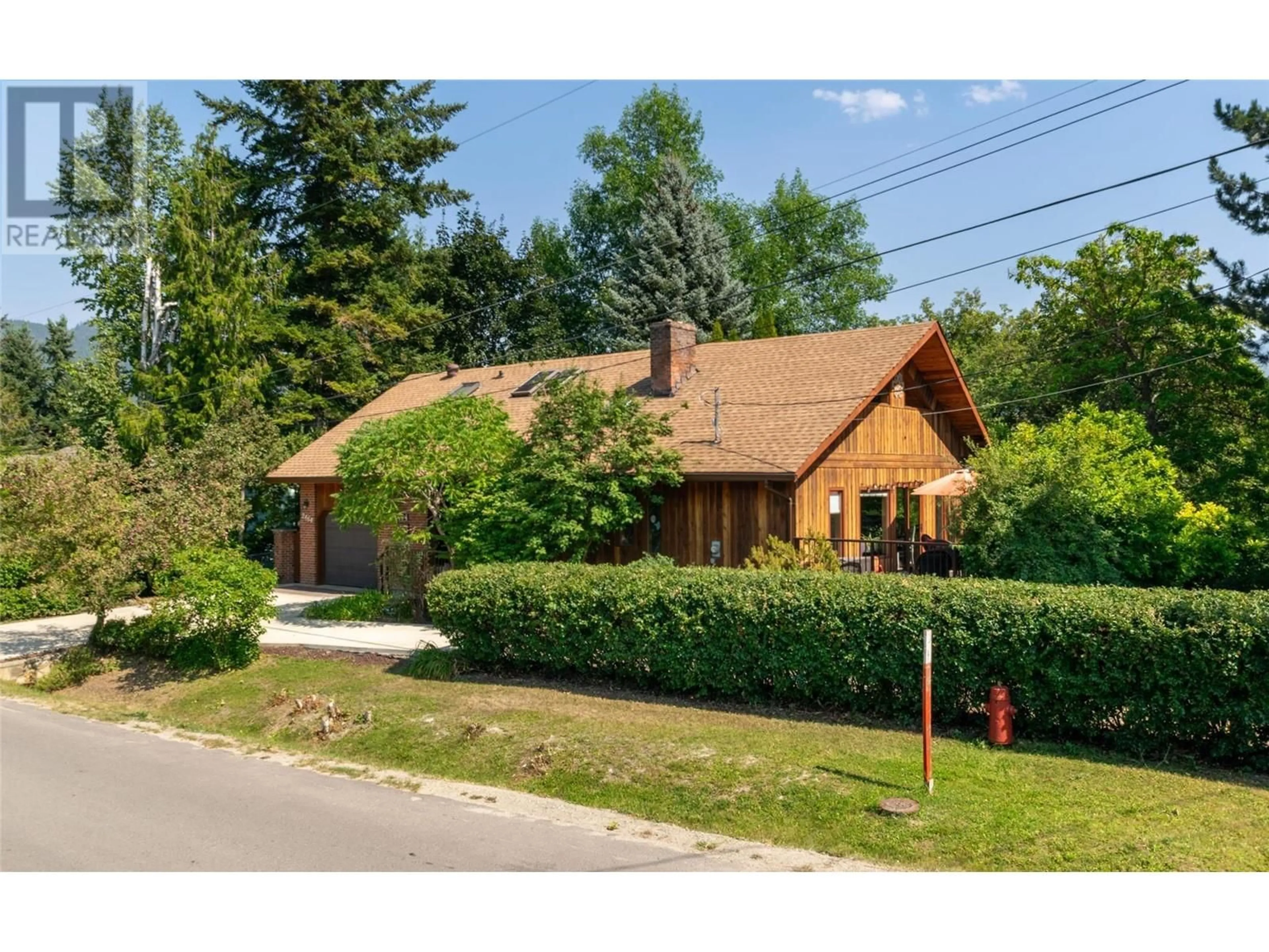Home with brick exterior material, street for 2464 WAVERLY DRIVE, Blind Bay British Columbia V0E2W0