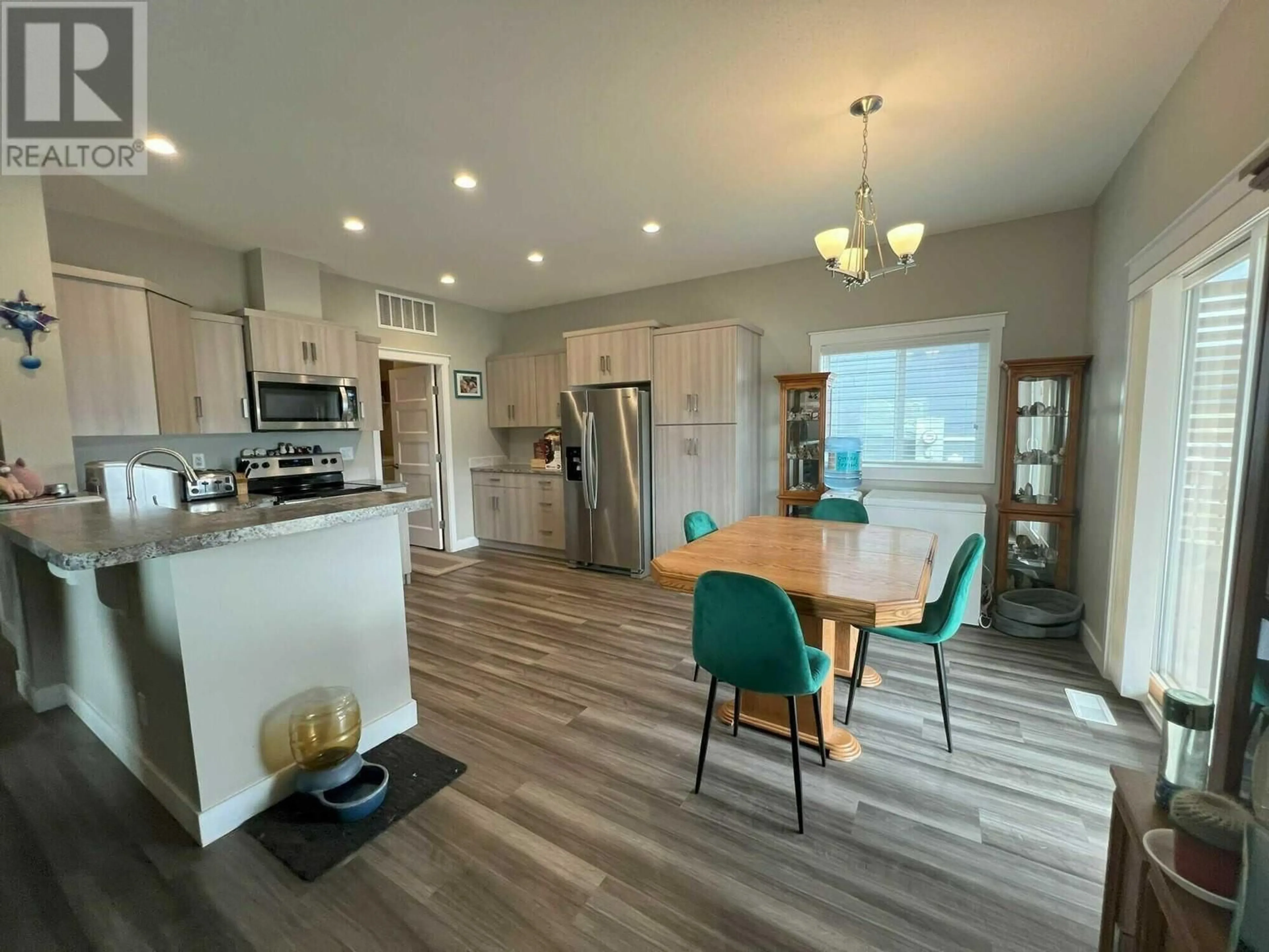 Open concept kitchen, wood/laminate floor for 2569 SPRING BANK AVENUE, Merritt British Columbia V1K1S1