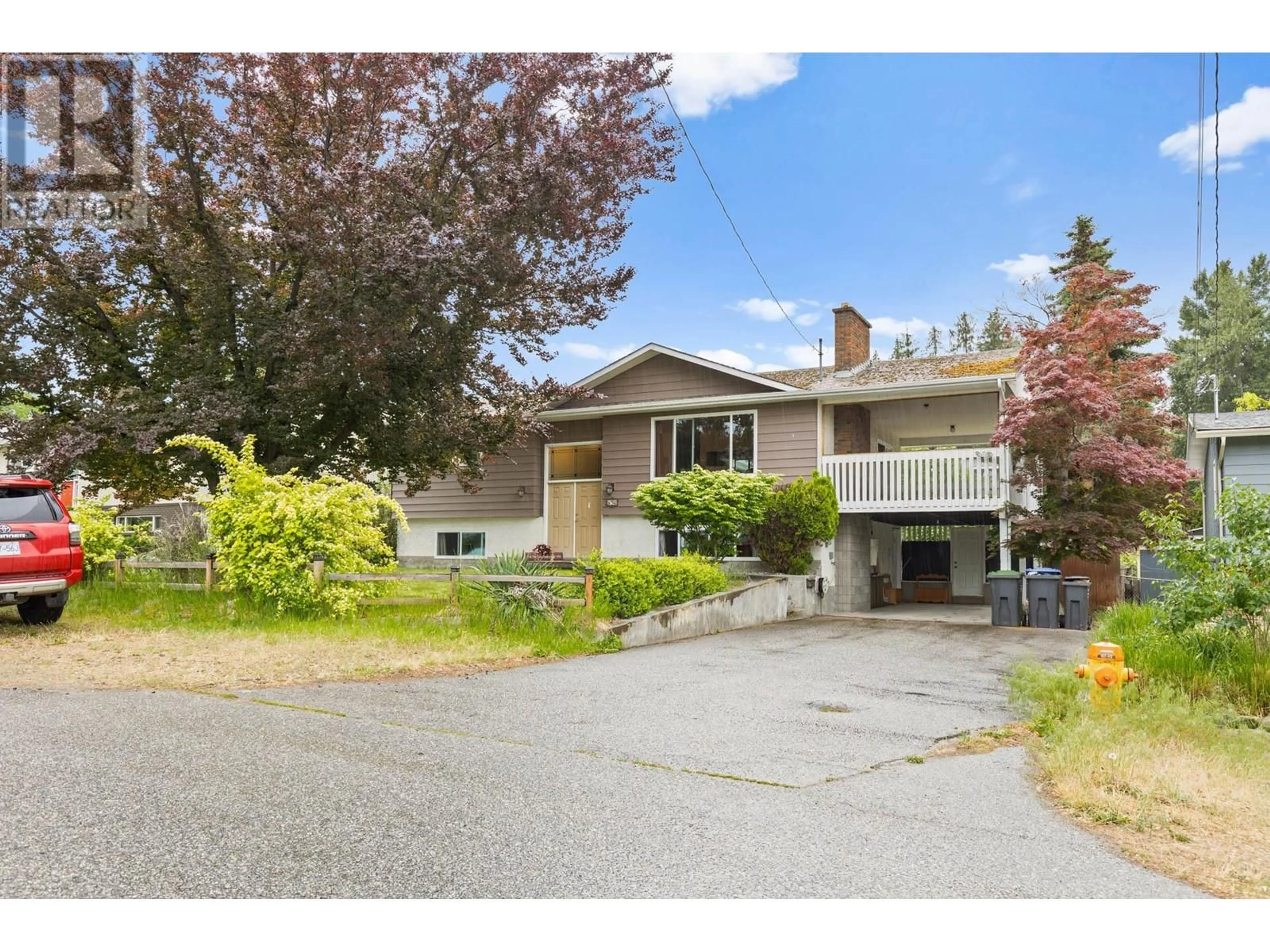 Home with vinyl exterior material, street for 853 HAMMER AVENUE, Kelowna British Columbia V1W2B7