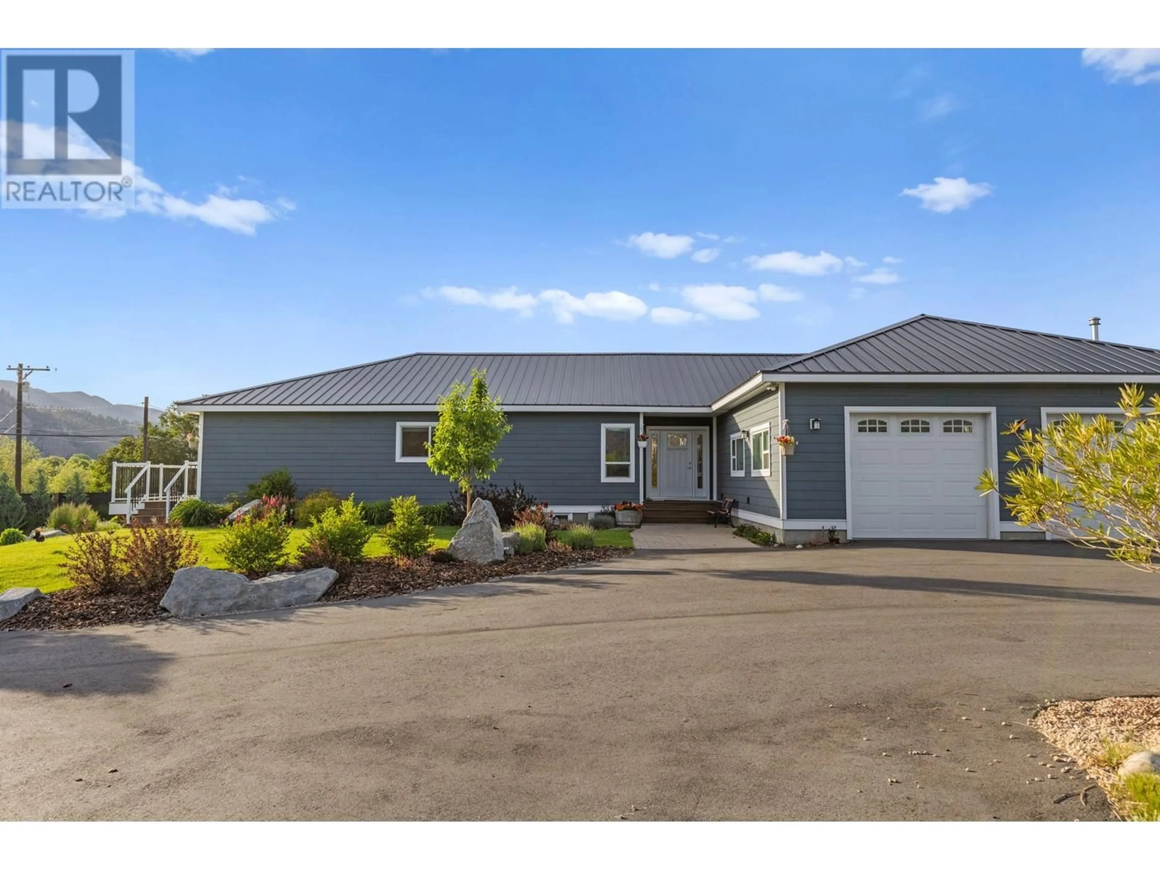 Home with vinyl exterior material, street for 7207 TUCELNUIT DRIVE, Oliver British Columbia V0H1T2