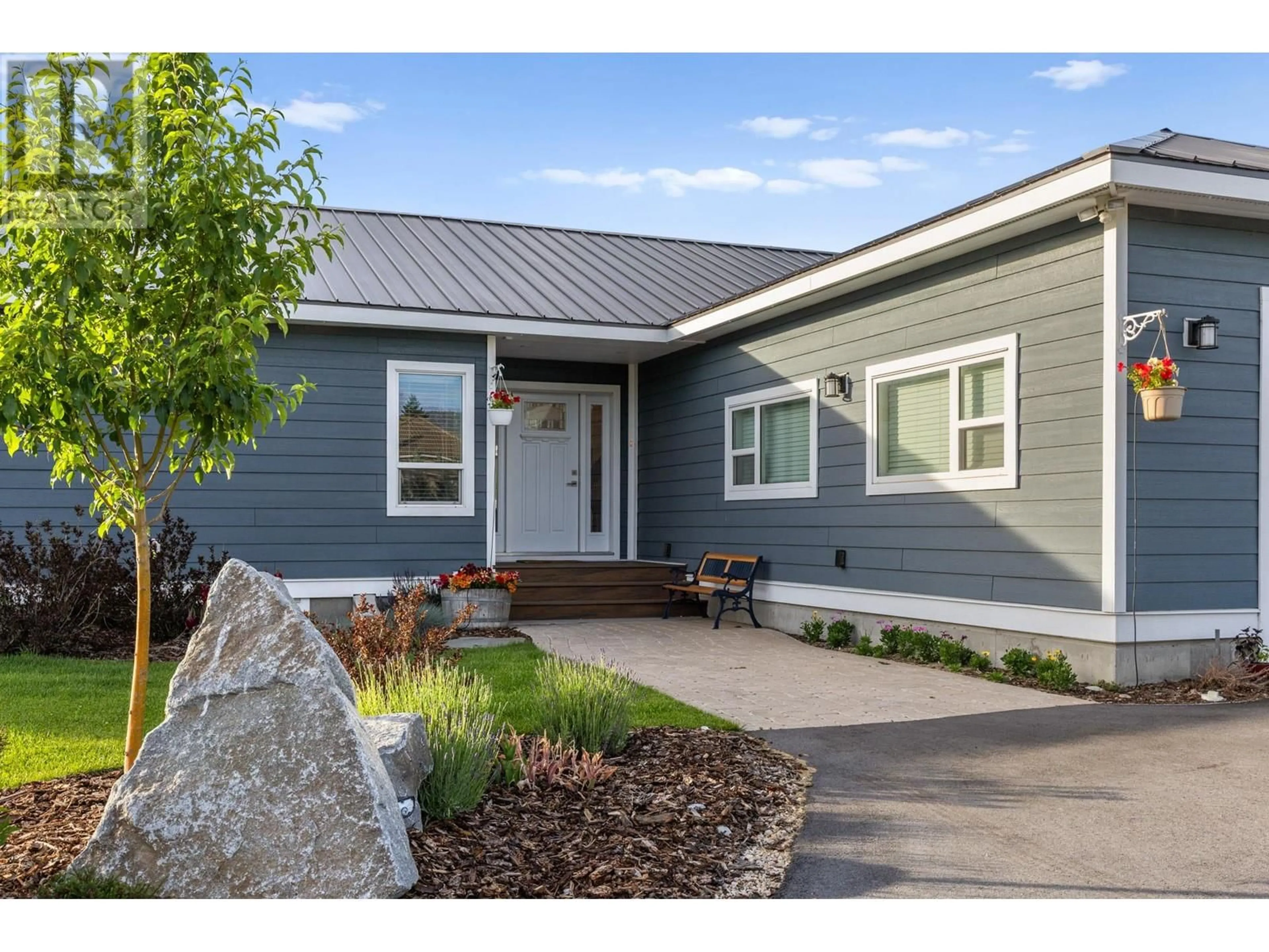 Home with vinyl exterior material, street for 7207 TUCELNUIT DRIVE, Oliver British Columbia V0H1T2