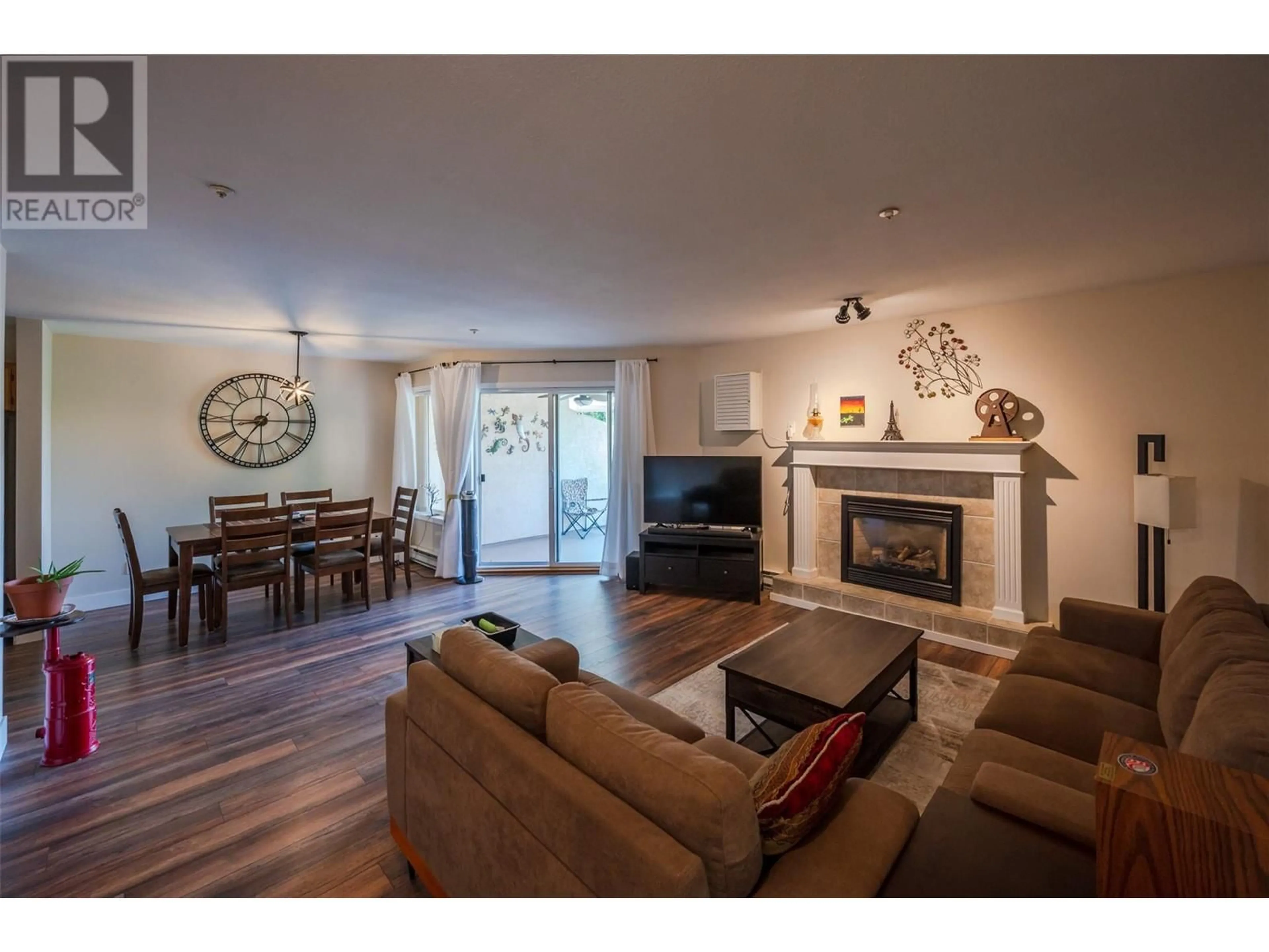 Living room with furniture, wood/laminate floor for 408 - 1750 ATKINSON STREET, Penticton British Columbia V2A7M6