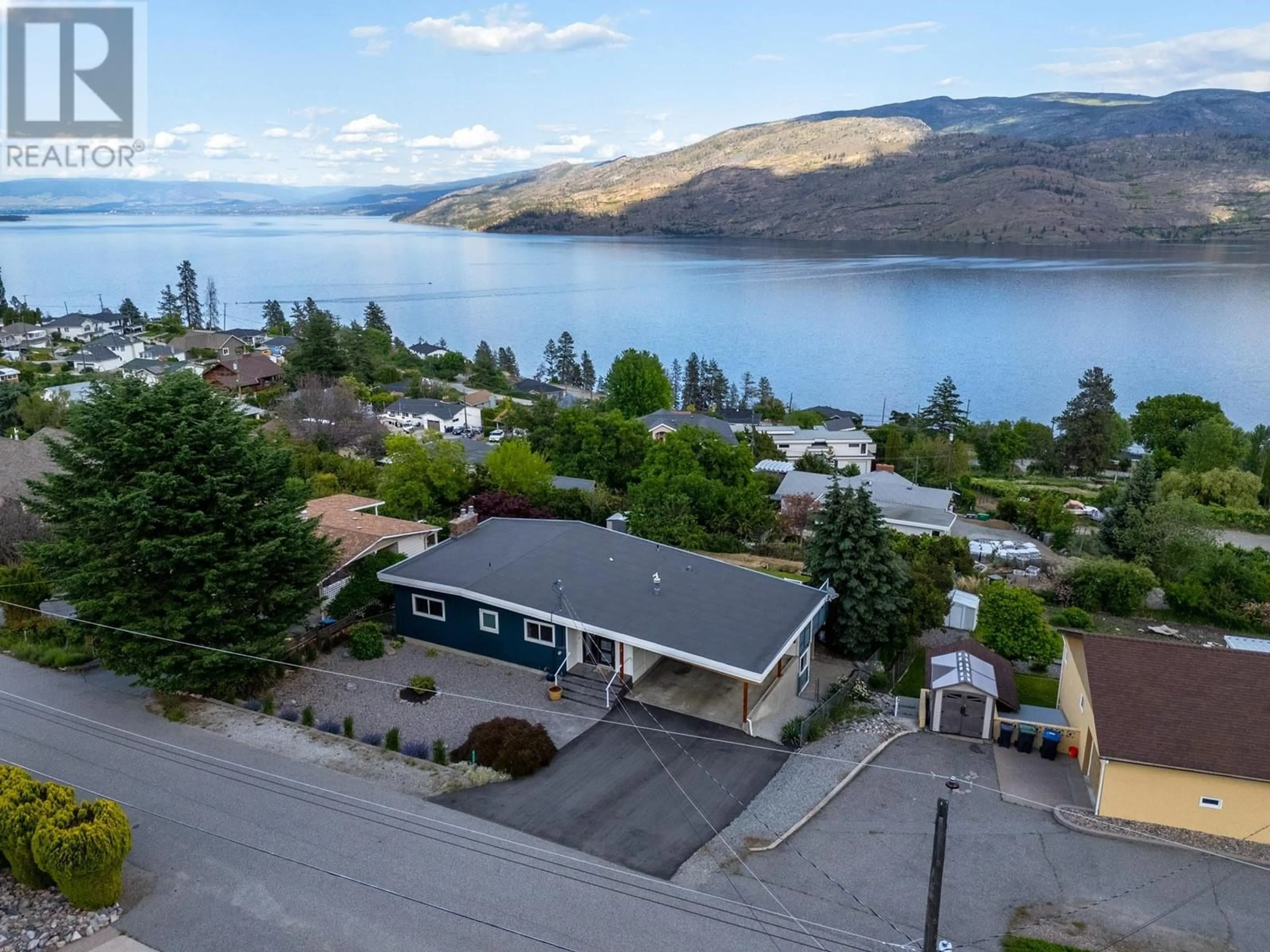 A pic from outside/outdoor area/front of a property/back of a property/a pic from drone, water/lake/river/ocean view for 6177 WILSON ROAD, Peachland British Columbia V0H1X7