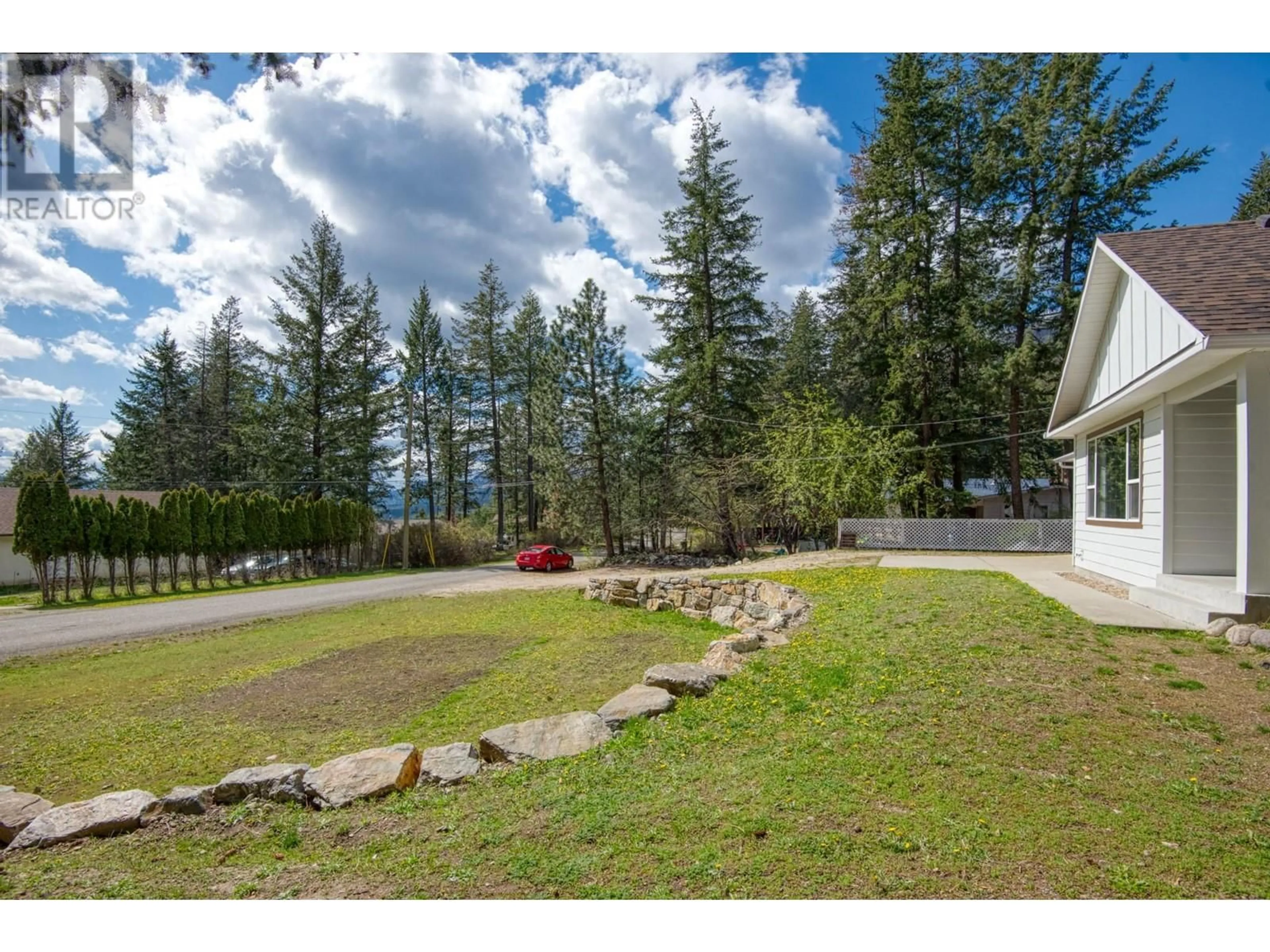 A pic from outside/outdoor area/front of a property/back of a property/a pic from drone, mountain view for 9532 HOUGHTON ROAD, Vernon British Columbia V1T2C9