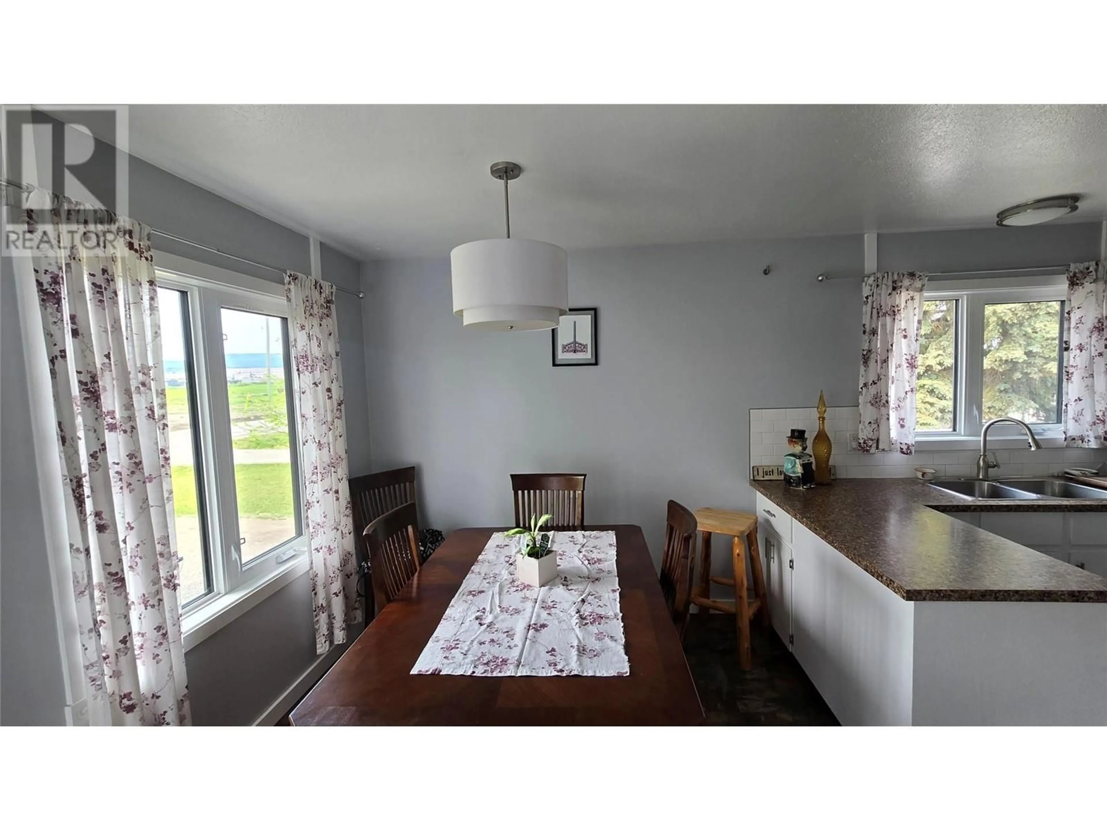 Dining room, wood/laminate floor for 1036 121 AVENUE, Dawson Creek British Columbia V1G3K4