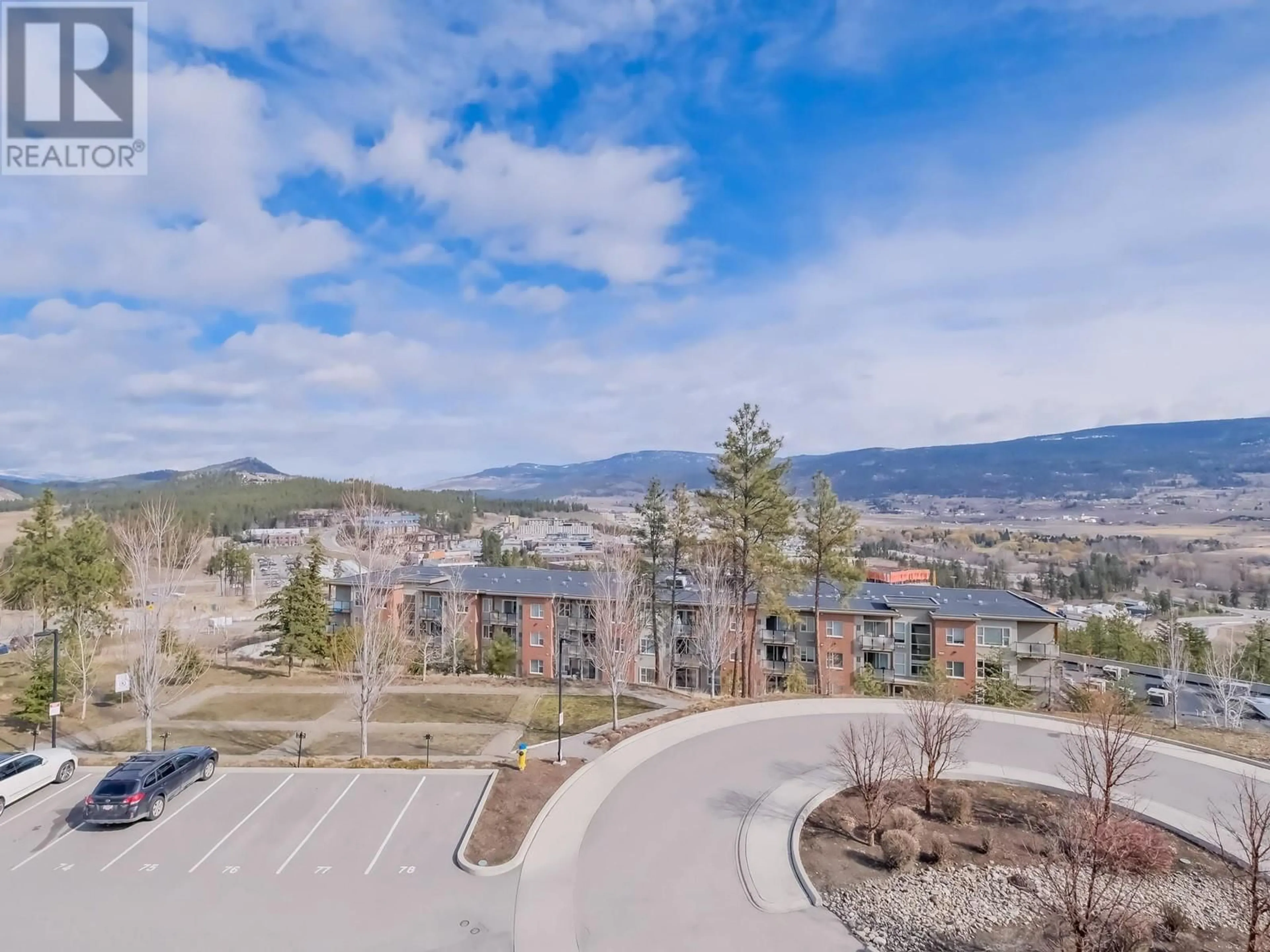 A pic from outside/outdoor area/front of a property/back of a property/a pic from drone, mountain view for 306 - 935 ACADEMY WAY, Kelowna British Columbia V1V3A4