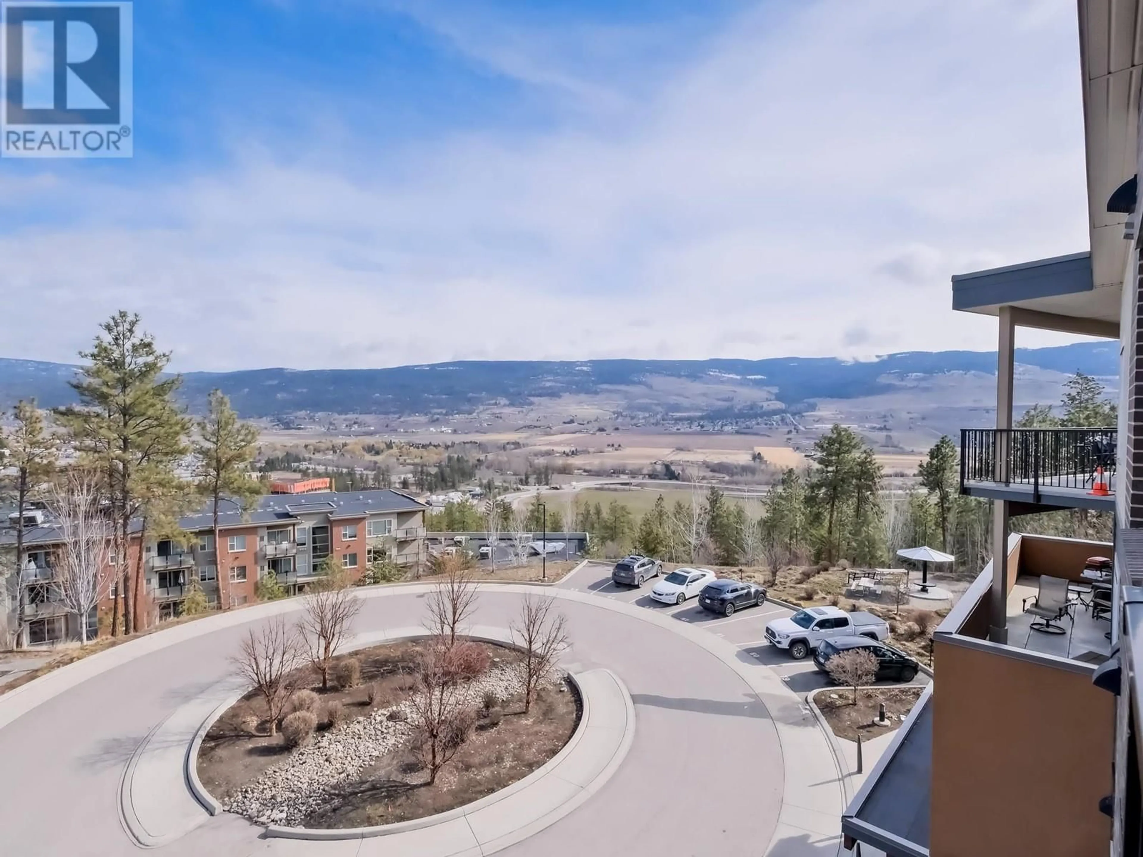 A pic from outside/outdoor area/front of a property/back of a property/a pic from drone, mountain view for 306 - 935 ACADEMY WAY, Kelowna British Columbia V1V3A4