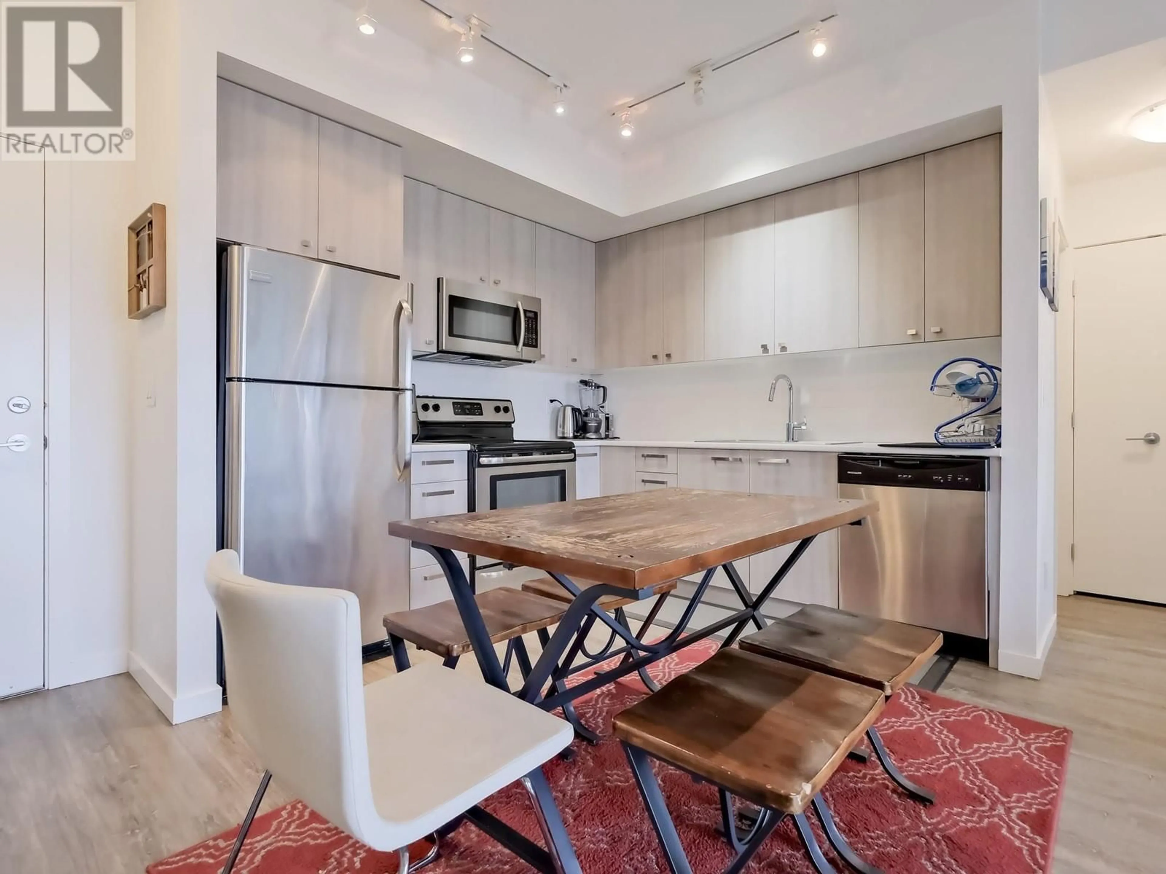 Open concept kitchen, unknown for 306 - 935 ACADEMY WAY, Kelowna British Columbia V1V3A4