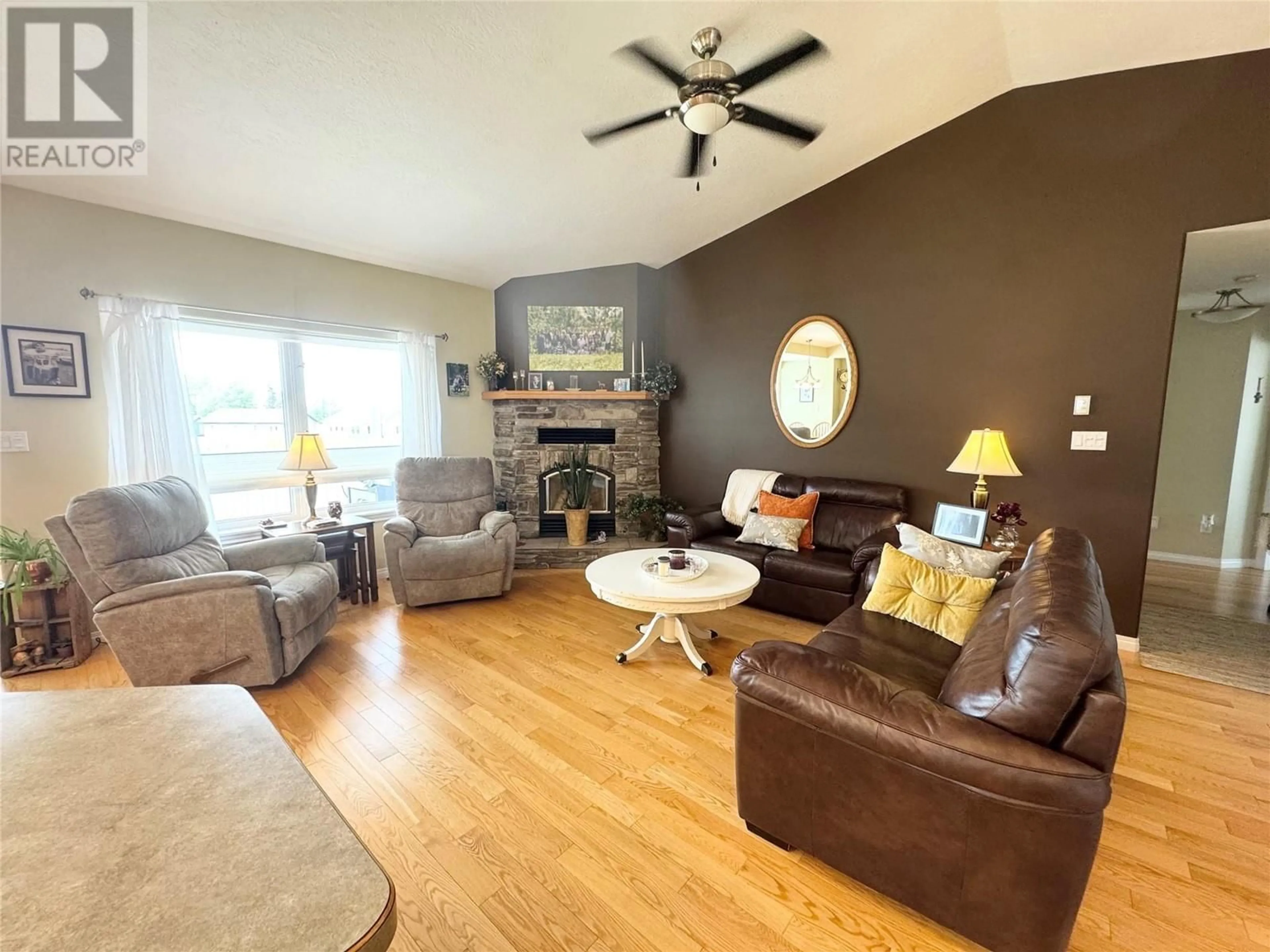 Living room with furniture, wood/laminate floor for 10916 TURGEON DRIVE, Dawson Creek British Columbia V1G2W8
