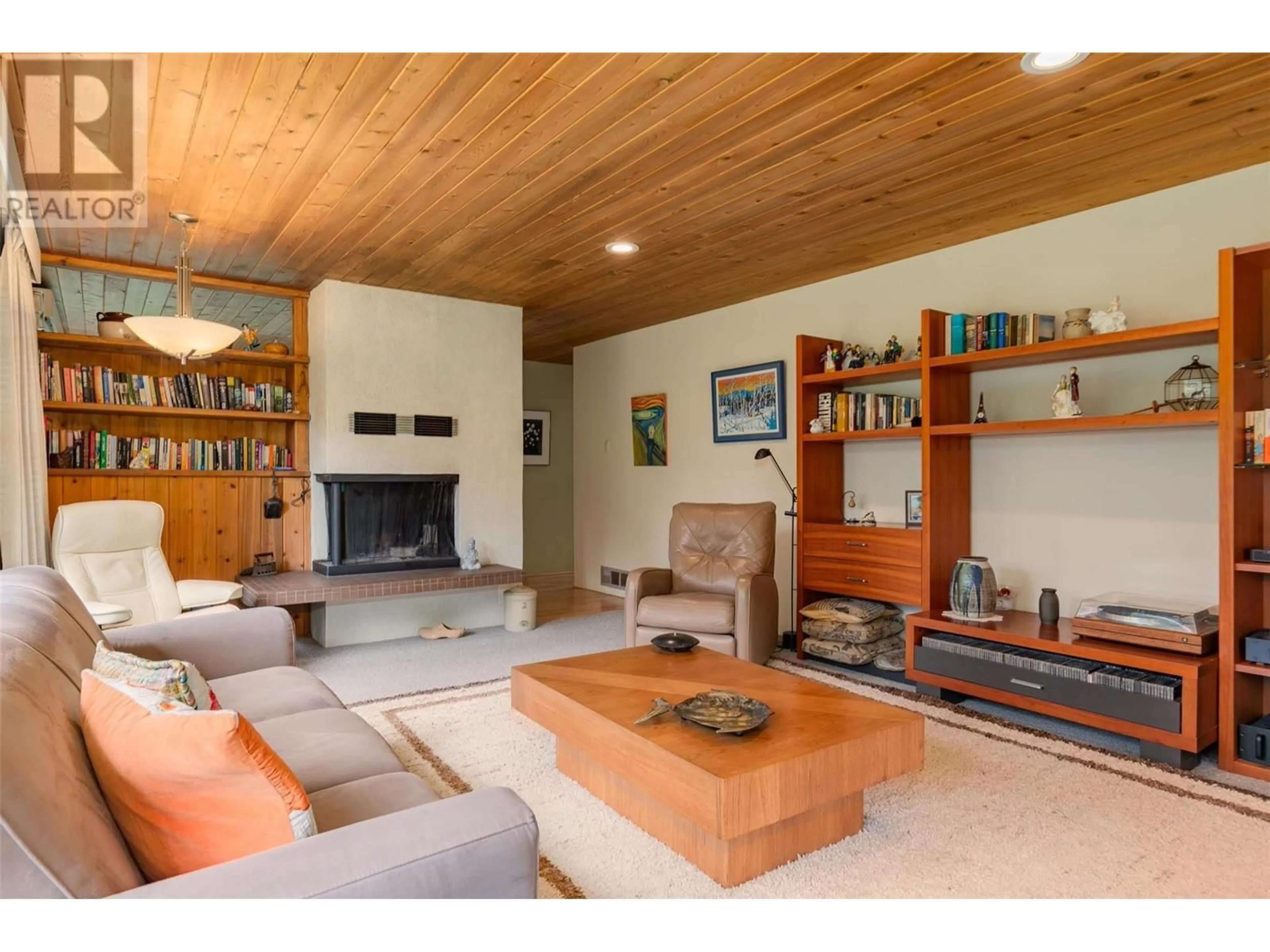 Living room with furniture, wood/laminate floor for 2083 GREEN ROAD, Fruitvale British Columbia V0G1L1