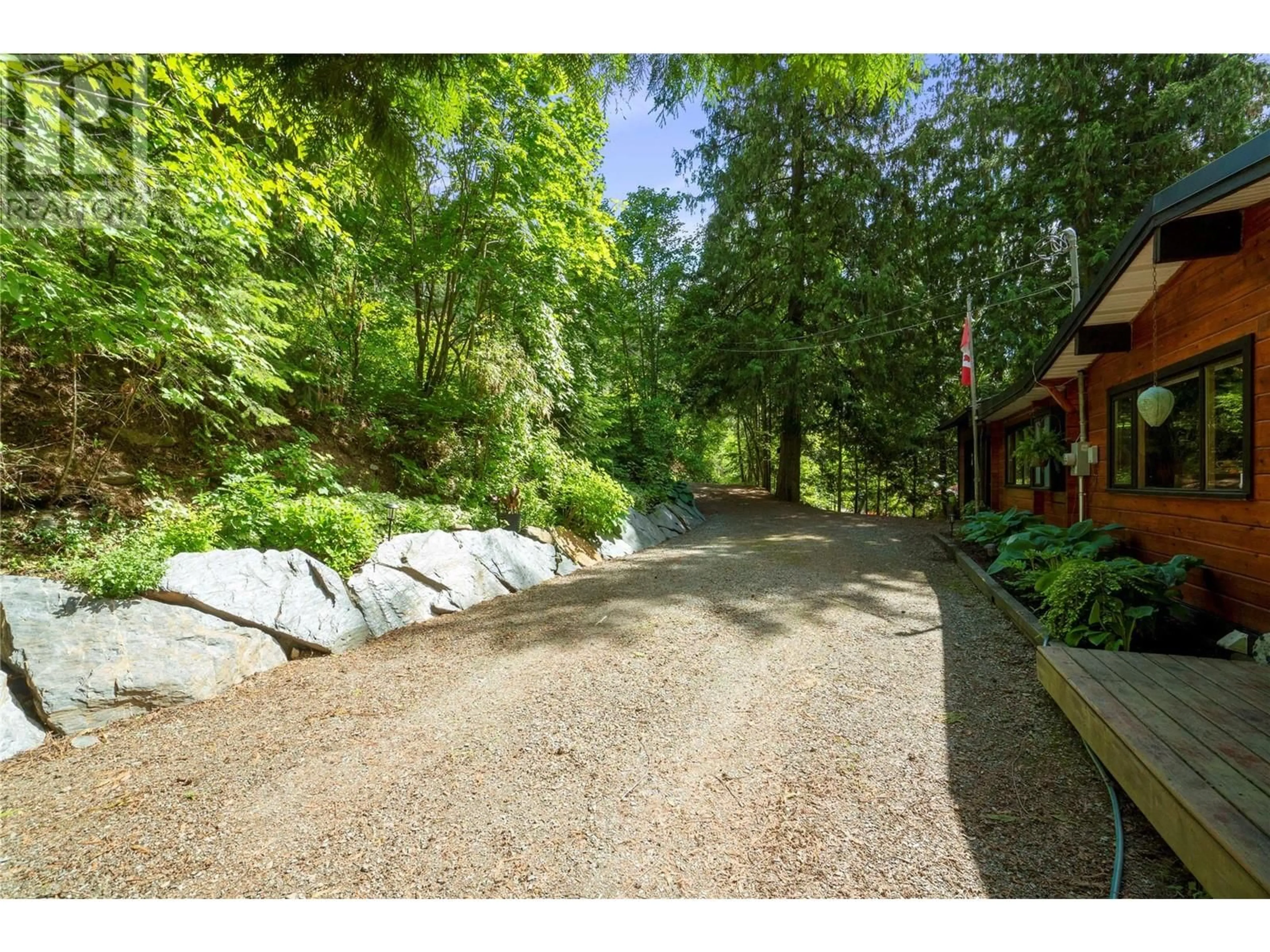 A pic from outside/outdoor area/front of a property/back of a property/a pic from drone, forest/trees view for 7792 COLUMBIA DRIVE, Anglemont British Columbia V0E1M8