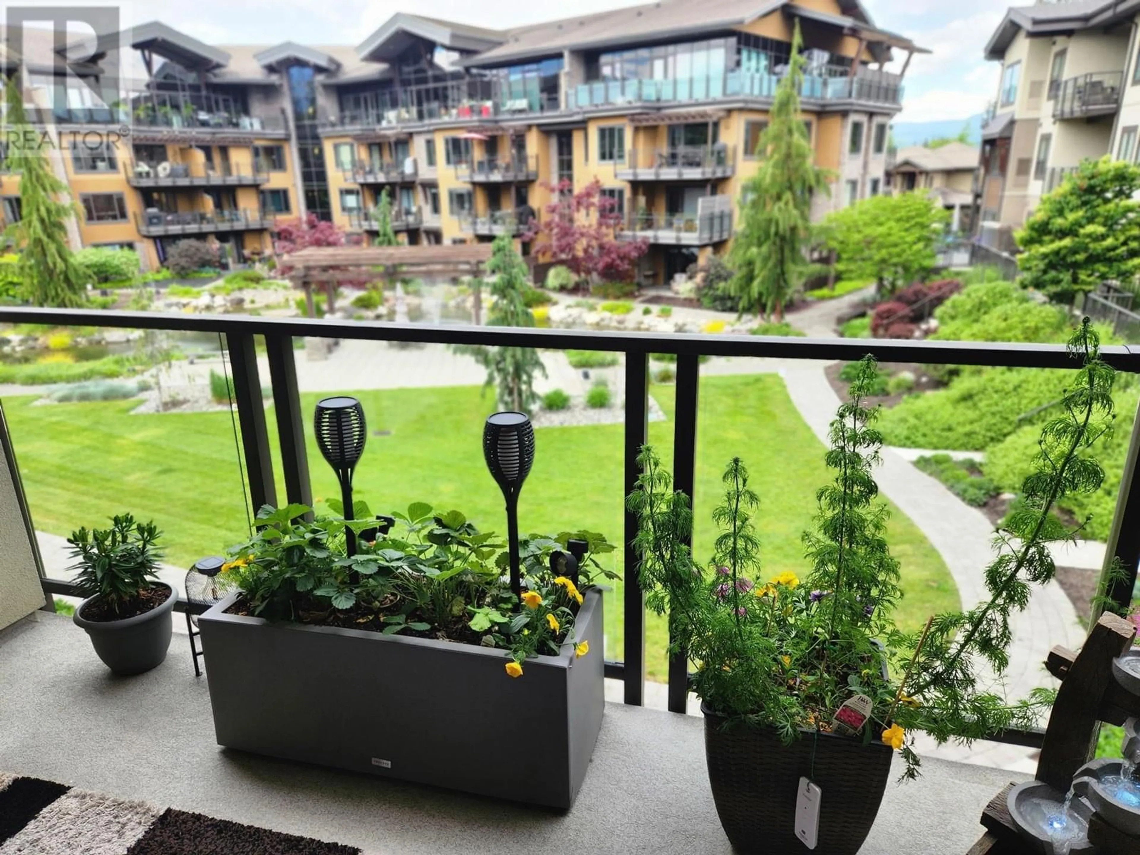 Patio, city buildings view from balcony for 226 - 4380 LAKESHORE ROAD, Kelowna British Columbia V1W5N3
