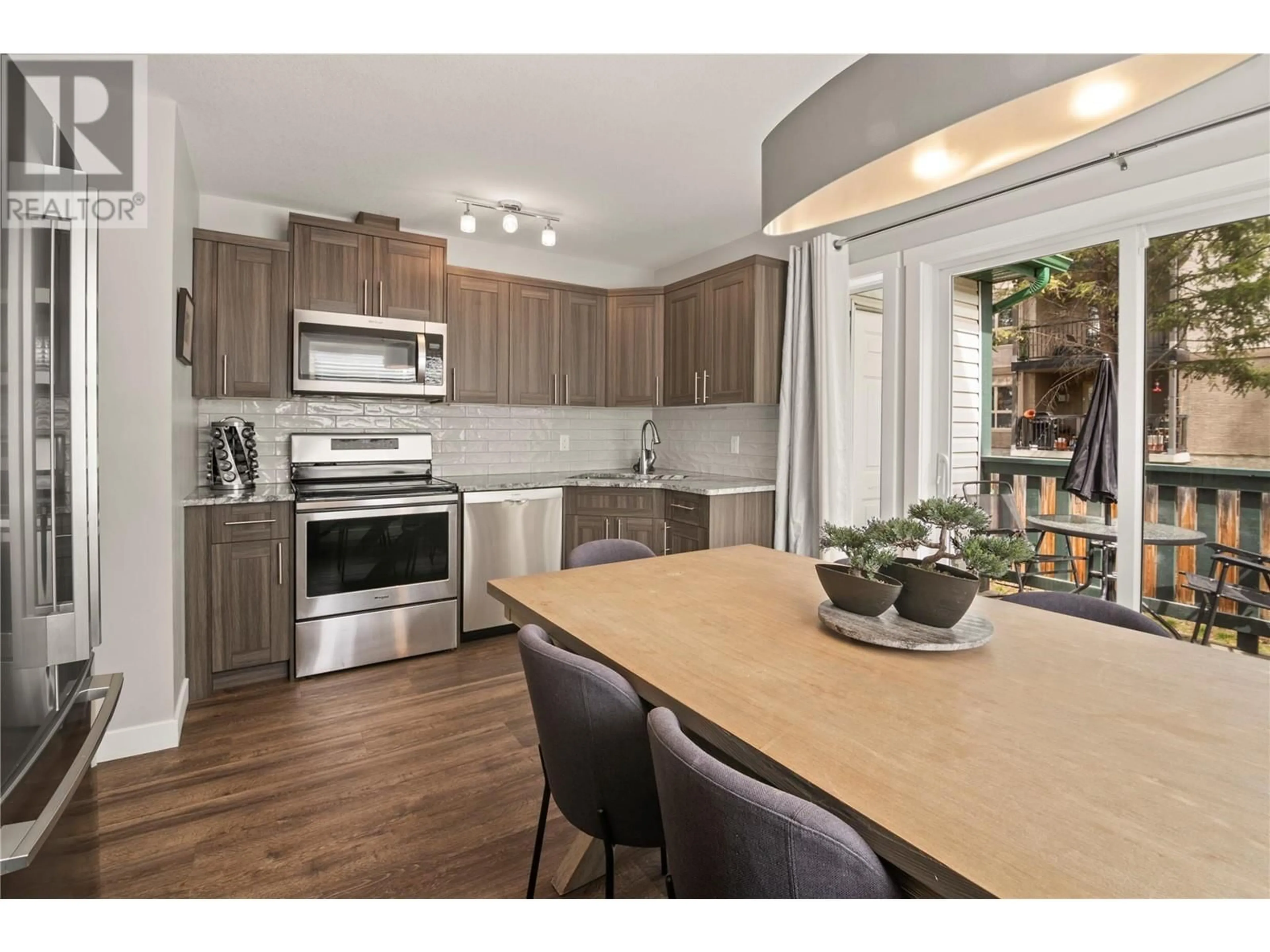 Open concept kitchen, wood/laminate floor for 111 - 4835 RADIUM BOULEVARD, Radium Hot Springs British Columbia V0A1M0