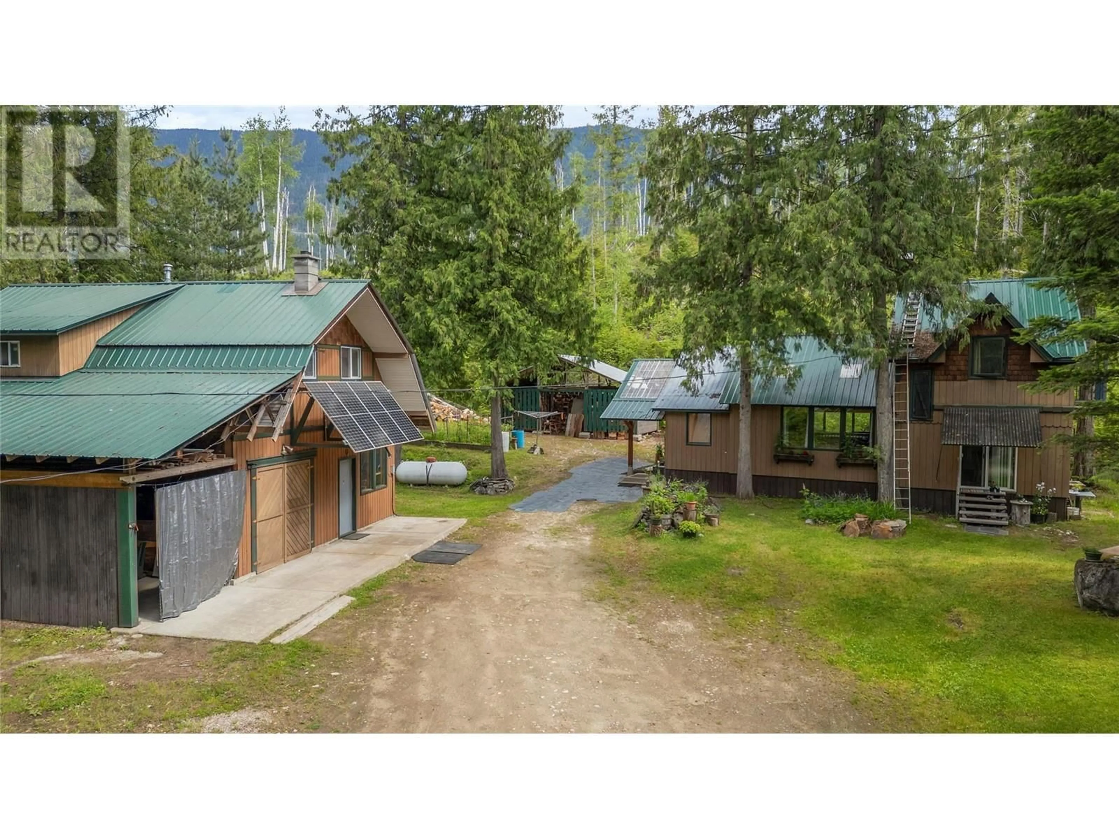 A pic from outside/outdoor area/front of a property/back of a property/a pic from drone, mountain view for 1598 QUAST ROAD, Seymour Arm British Columbia V0E2V2