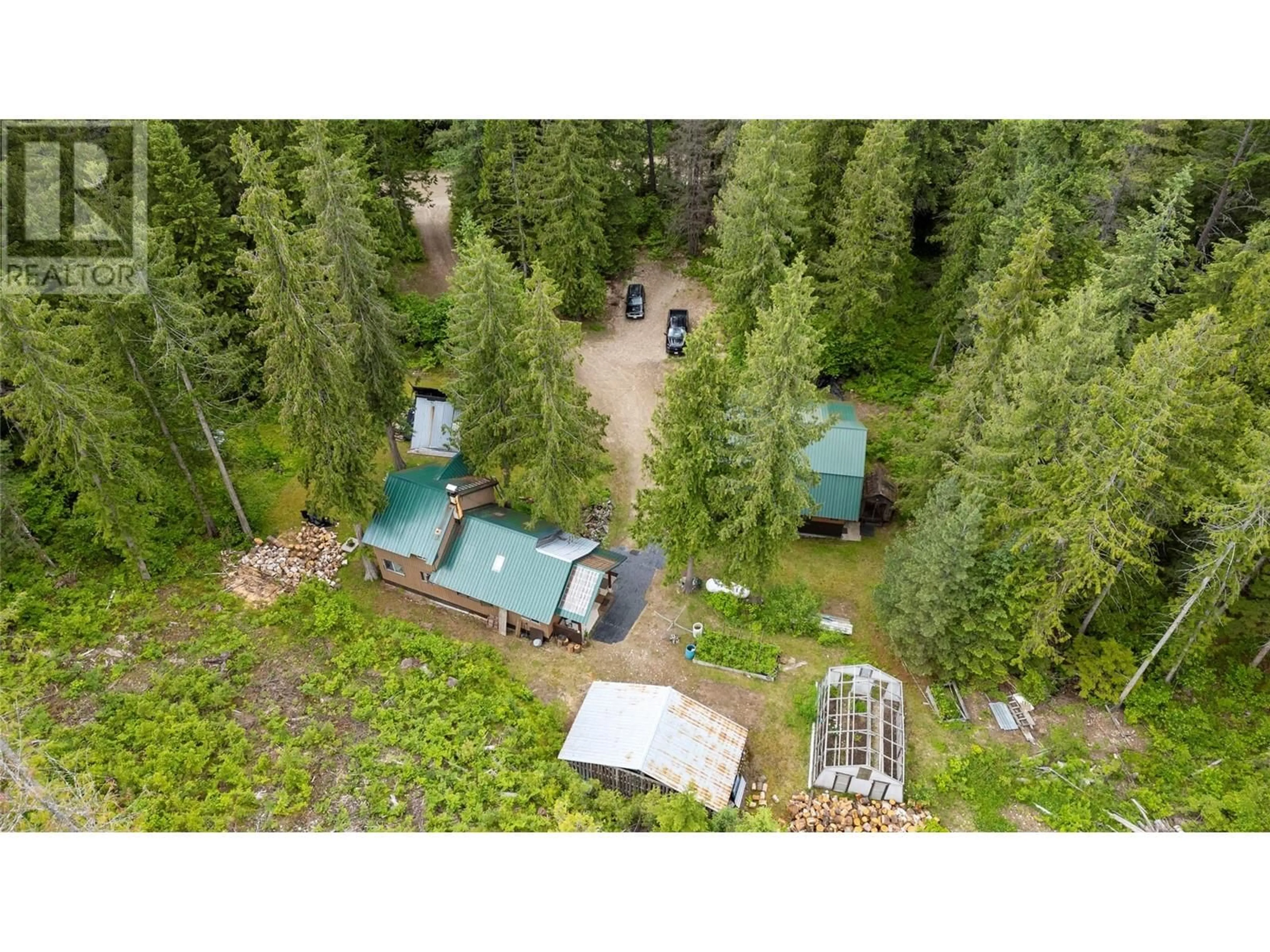 A pic from outside/outdoor area/front of a property/back of a property/a pic from drone, forest/trees view for 1598 QUAST ROAD, Seymour Arm British Columbia V0E2V2
