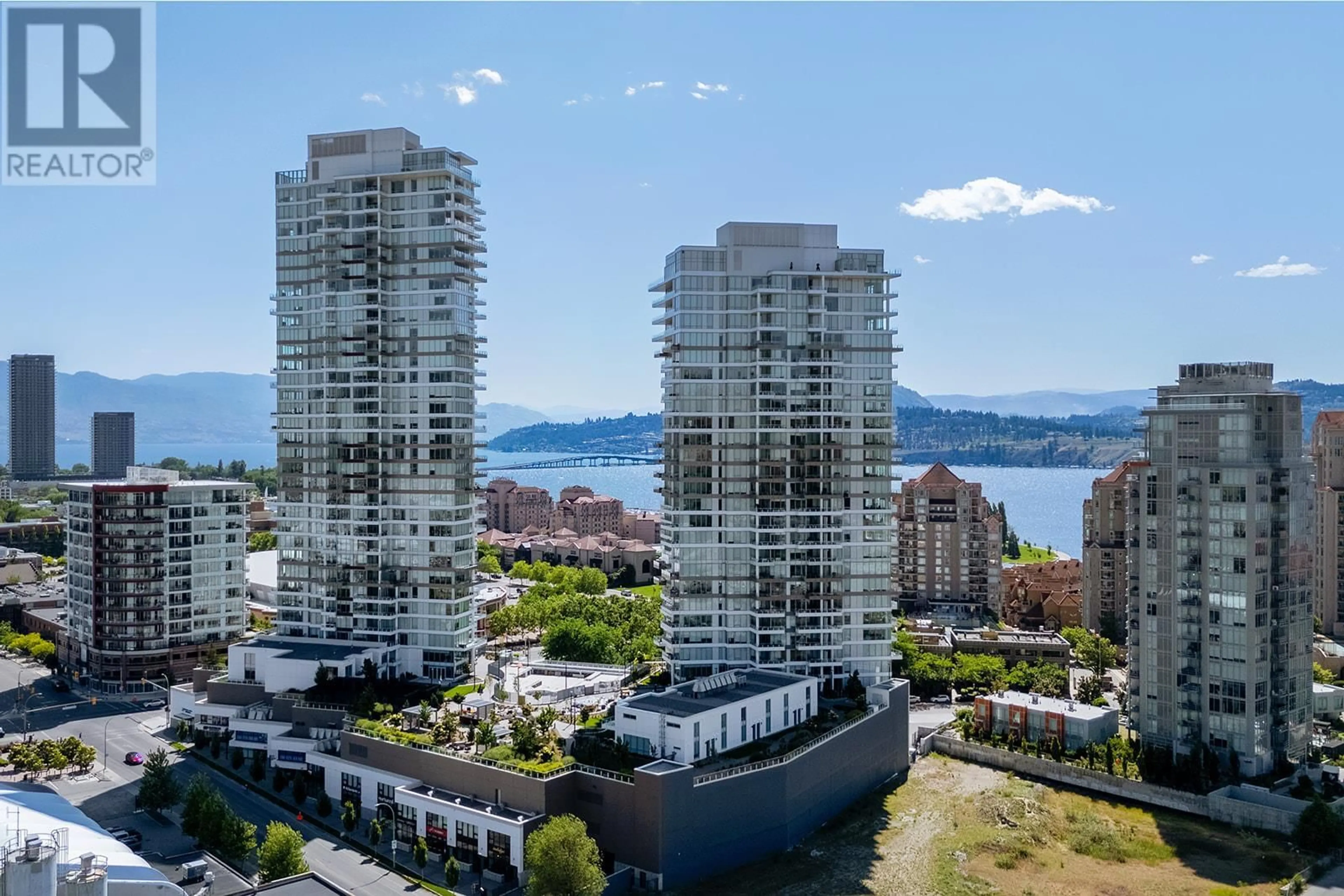 A pic from outside/outdoor area/front of a property/back of a property/a pic from drone, water/lake/river/ocean view for 2408 - 1181 SUNSET DRIVE, Kelowna British Columbia V1Y0L4