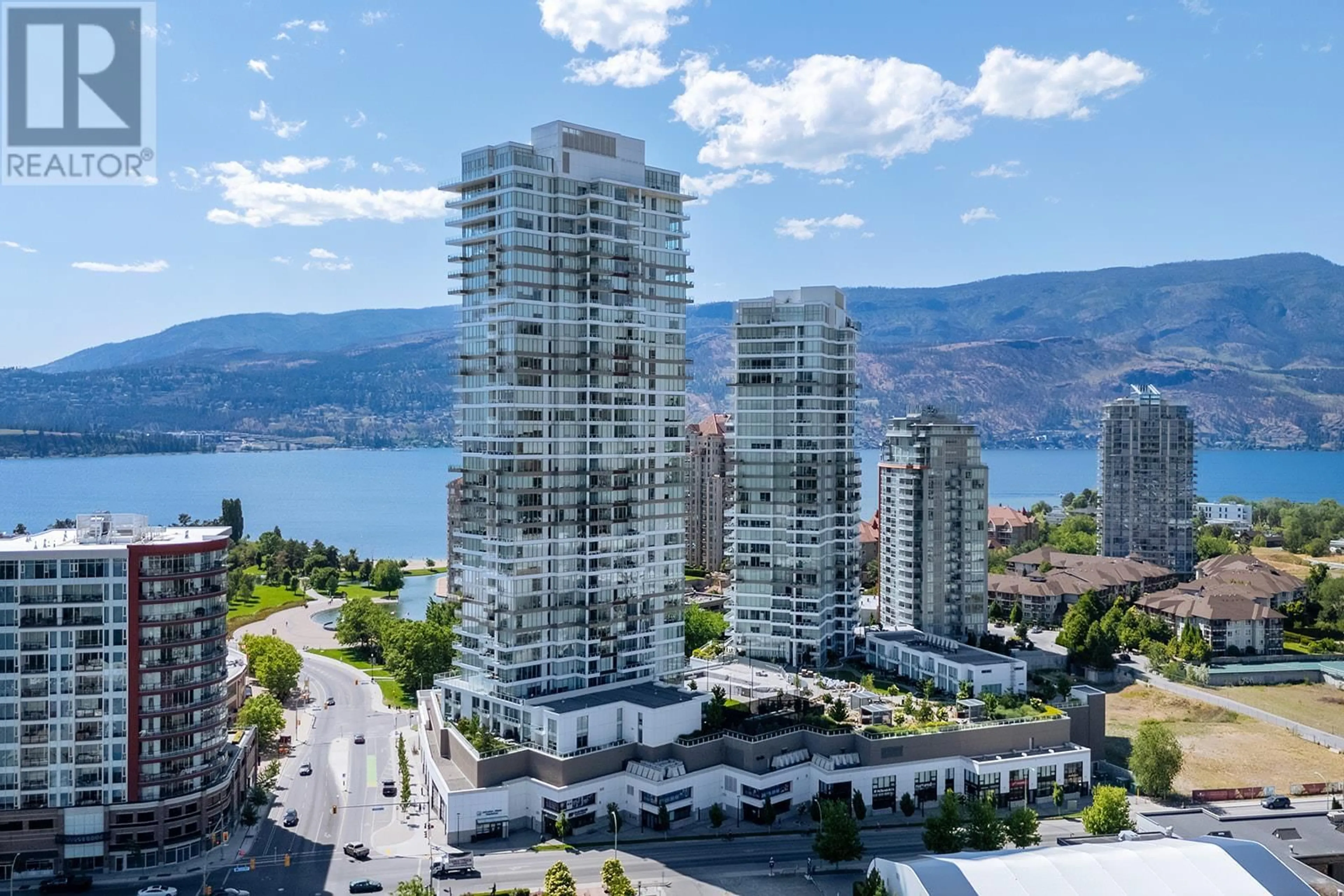 A pic from outside/outdoor area/front of a property/back of a property/a pic from drone, water/lake/river/ocean view for 2408 - 1181 SUNSET DRIVE, Kelowna British Columbia V1Y0L4