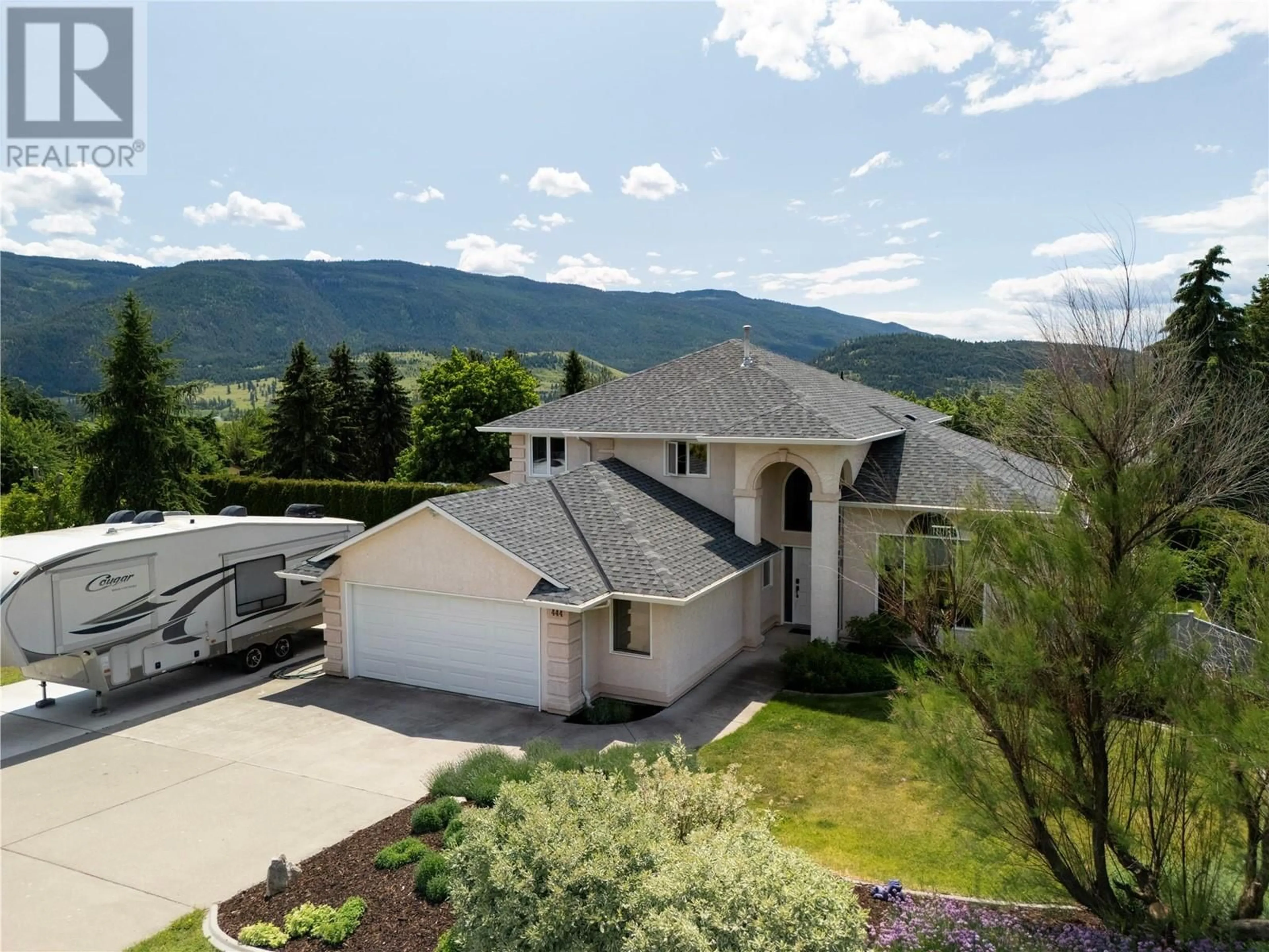 A pic from outside/outdoor area/front of a property/back of a property/a pic from drone, mountain view for 444 ROCKLAND DRIVE, Coldstream British Columbia V1B2X5